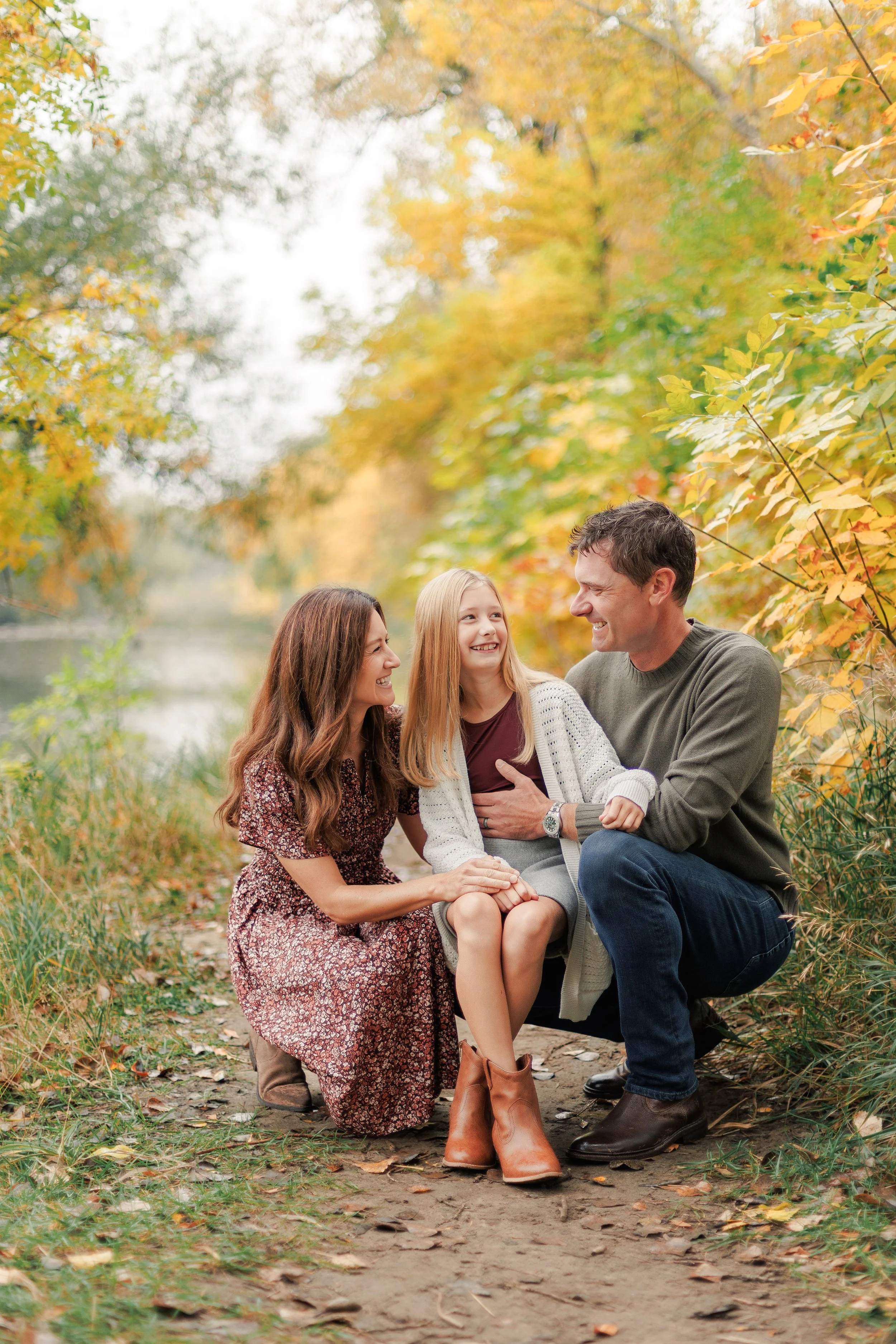 A family portrait near the river during a Fort Collins photography mini session in the fall.