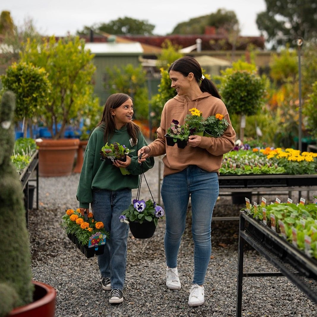 Two women walking in a nursery.jpg