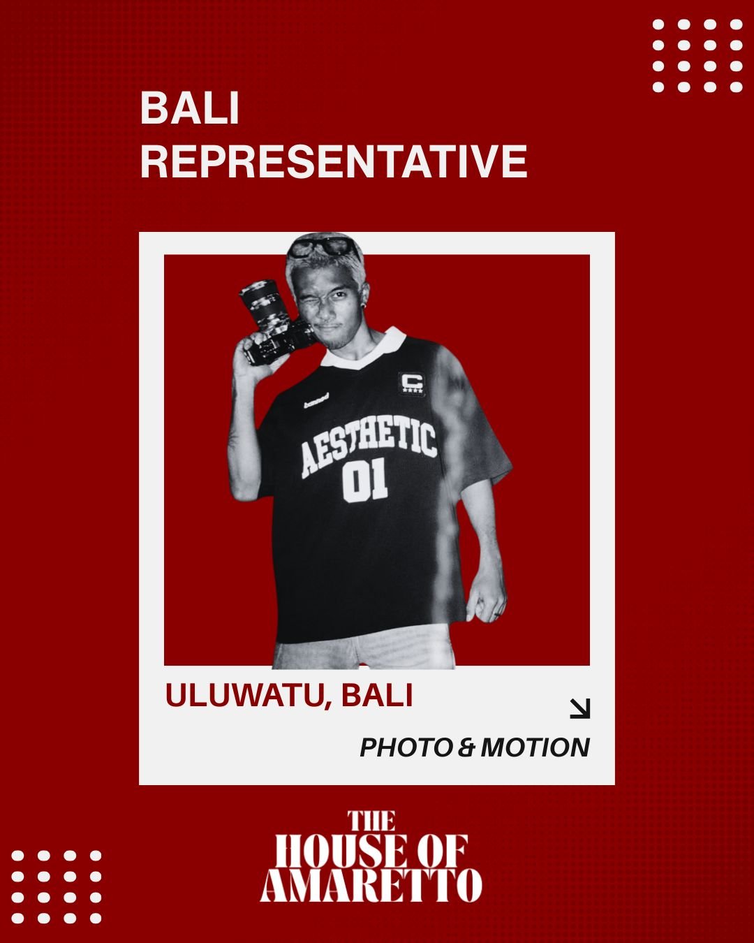 A promotional poster for a Bali representative event at Uluwatu, Bali featuring a person holding a camera, wearing a black sports jersey with 'AESTHETIC 01' printed on it, and the logo 'The House of Amaretto' at the bottom.