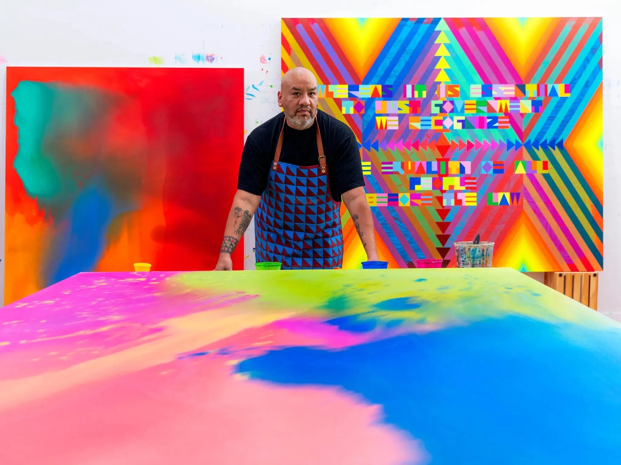 "Representing the U.S. and Critiquing It in a Psychedelic Rainbow."