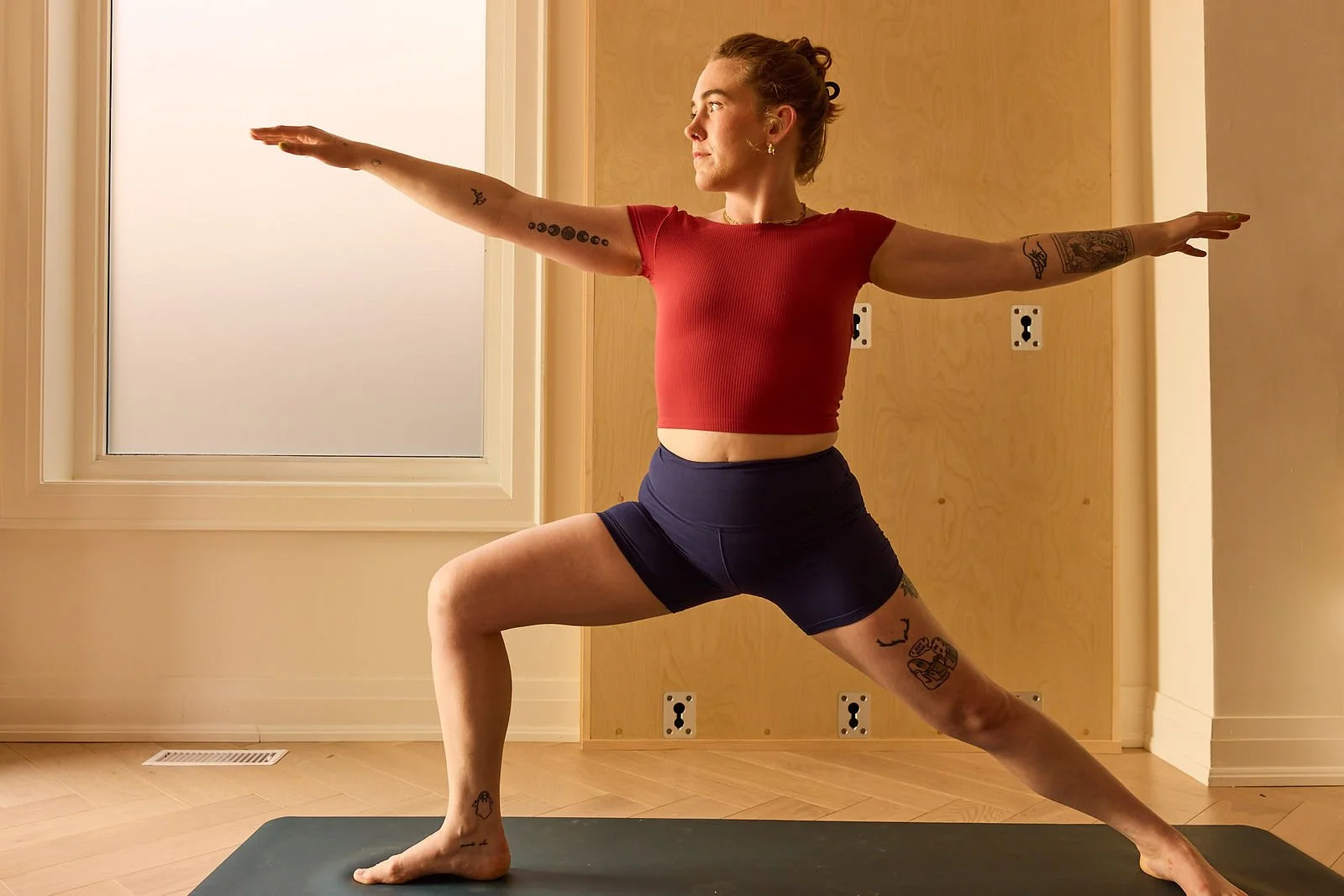 Woman doing a yoga class at SEQUINS studio in Toronto