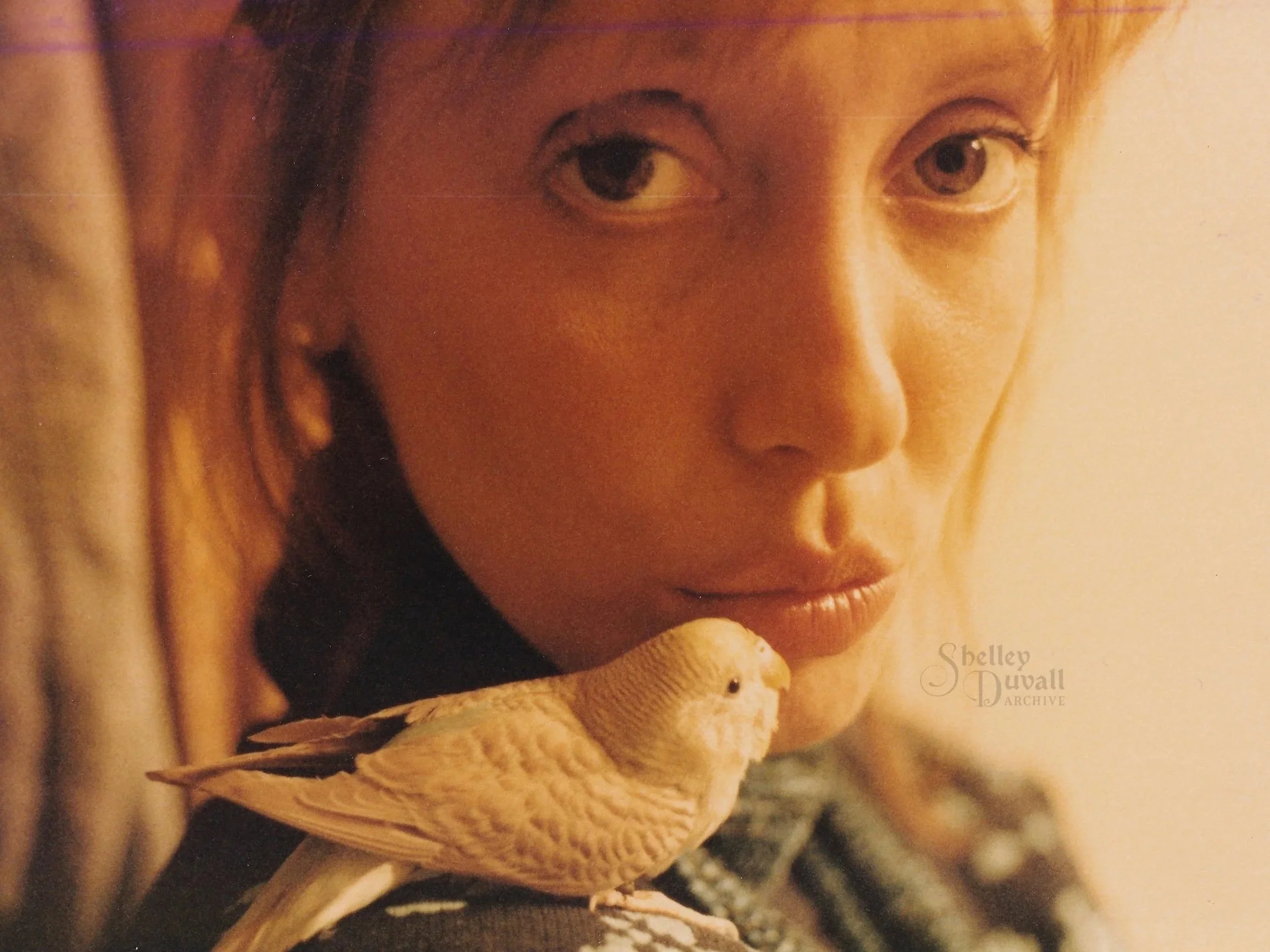 With one of her beloved birds. Undated photo.
