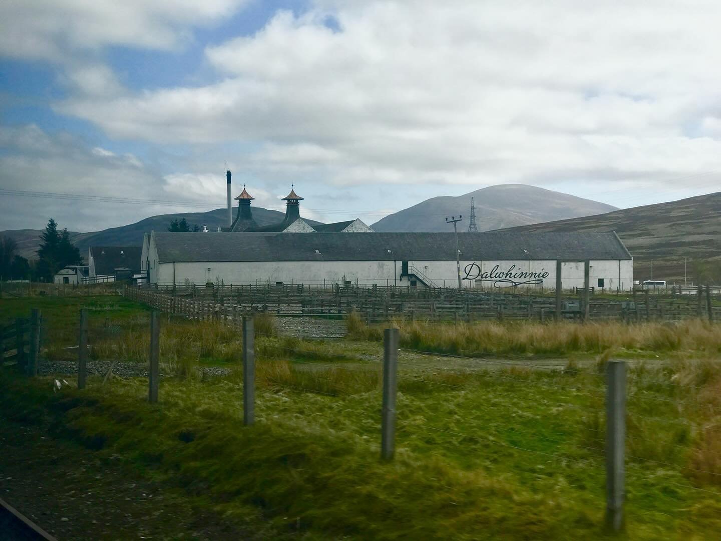 Dalwhinnie, the distillery at the highest elevation in Scotland, as seen from ScotRail heading north towards Inverness.