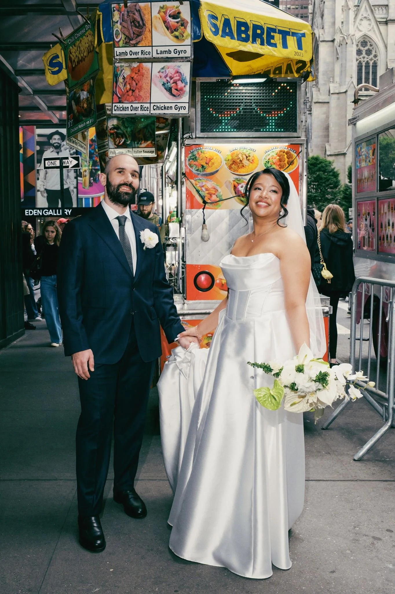 wedding florals modeled in front of nyc hot dog stand