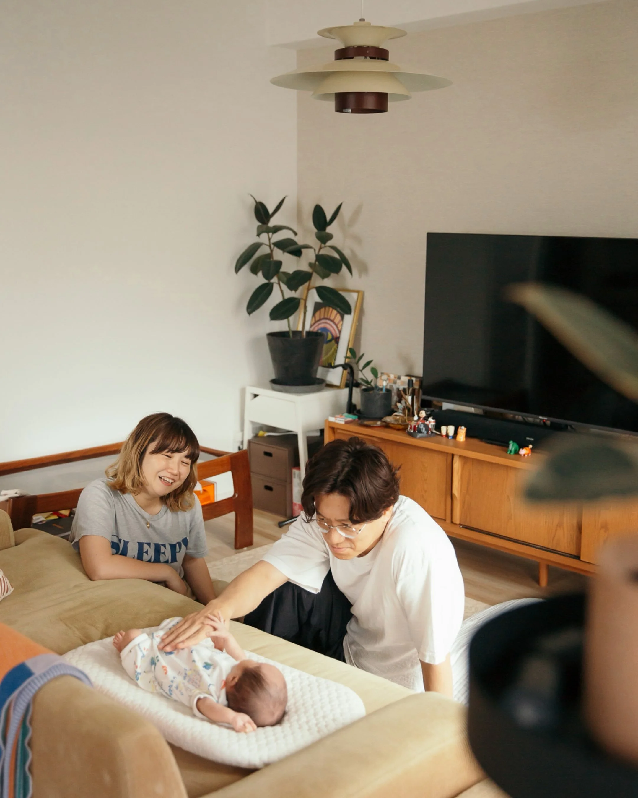 And then, there you were. 

A few months ago, I photographed these two as they waited to meet their baby.
And now, I got to meet the little one they had been waiting for.
From their honeymoon in Brooklyn in 2019, to maternity photos in Tokyo, and now