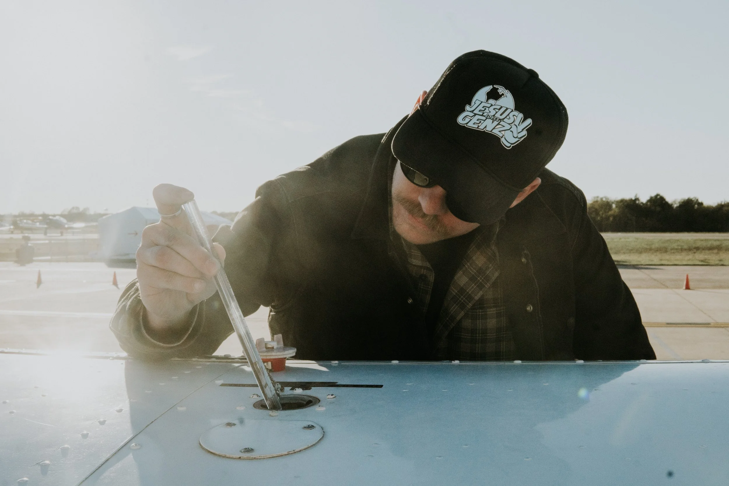 Person checking fuel on Cessna 172