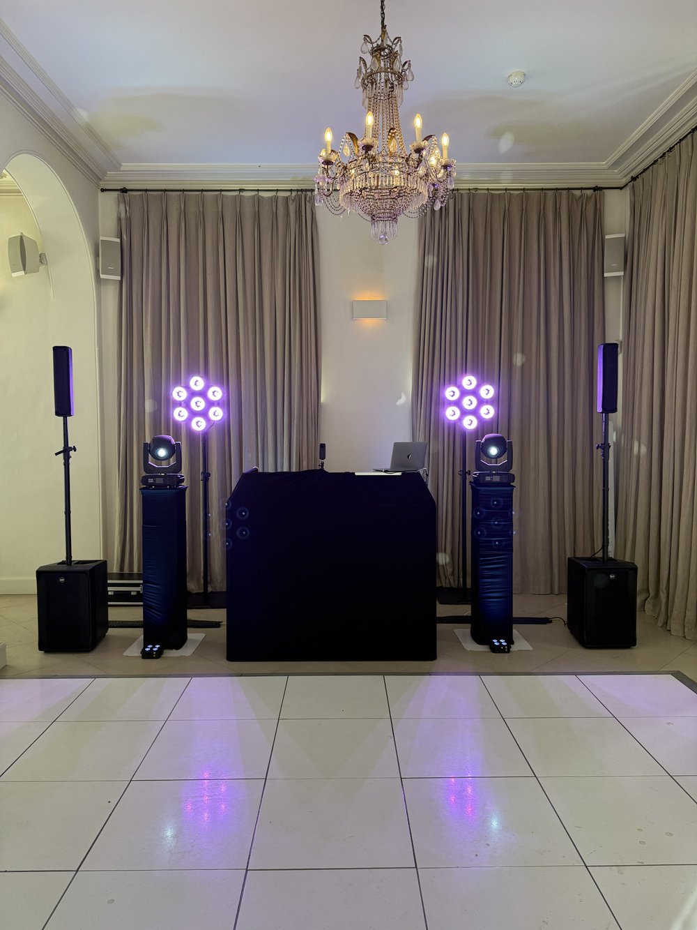 Sleek all-black wedding DJ booth