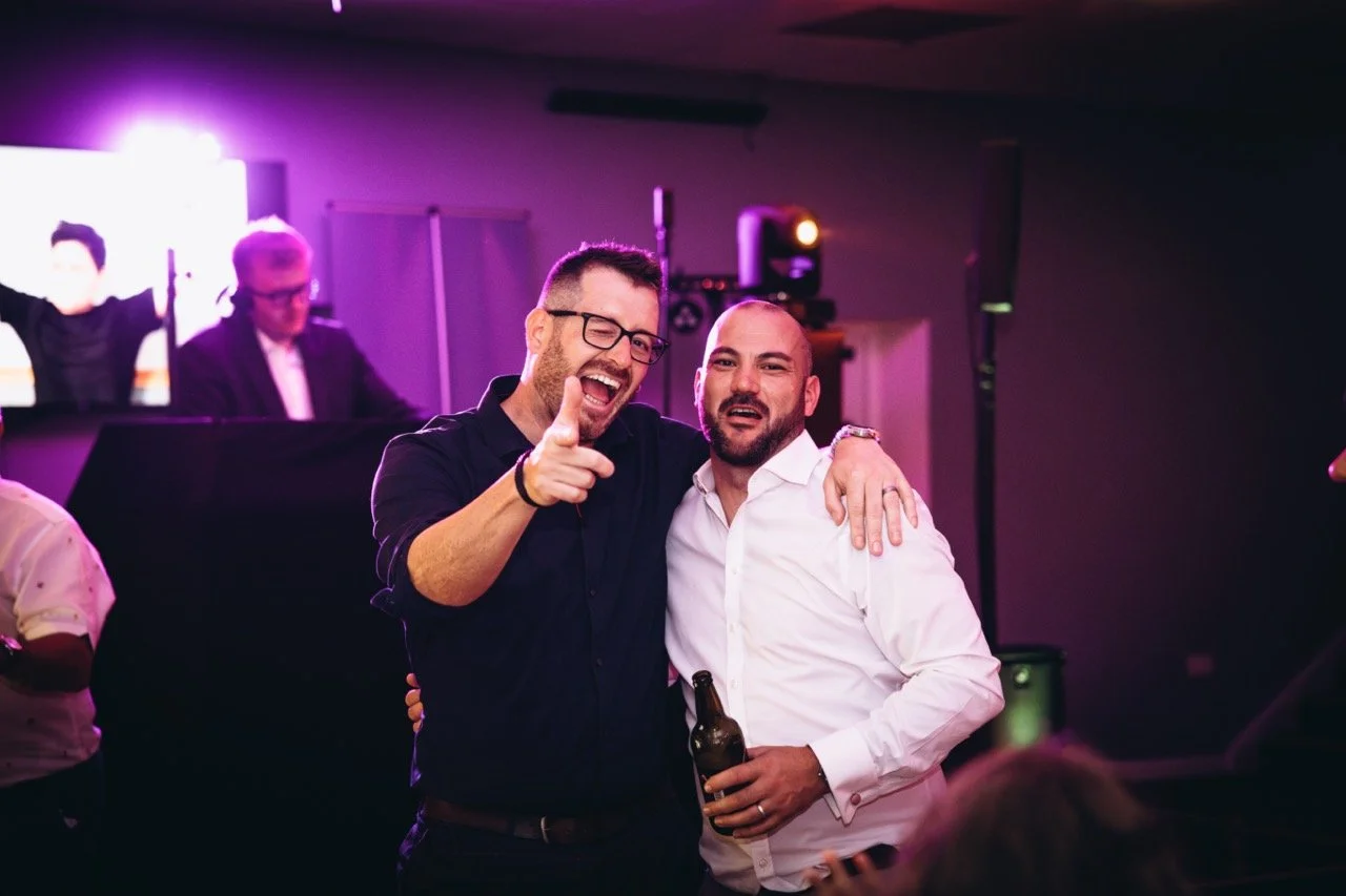 Wedding guests celebrating together on the dancefloor