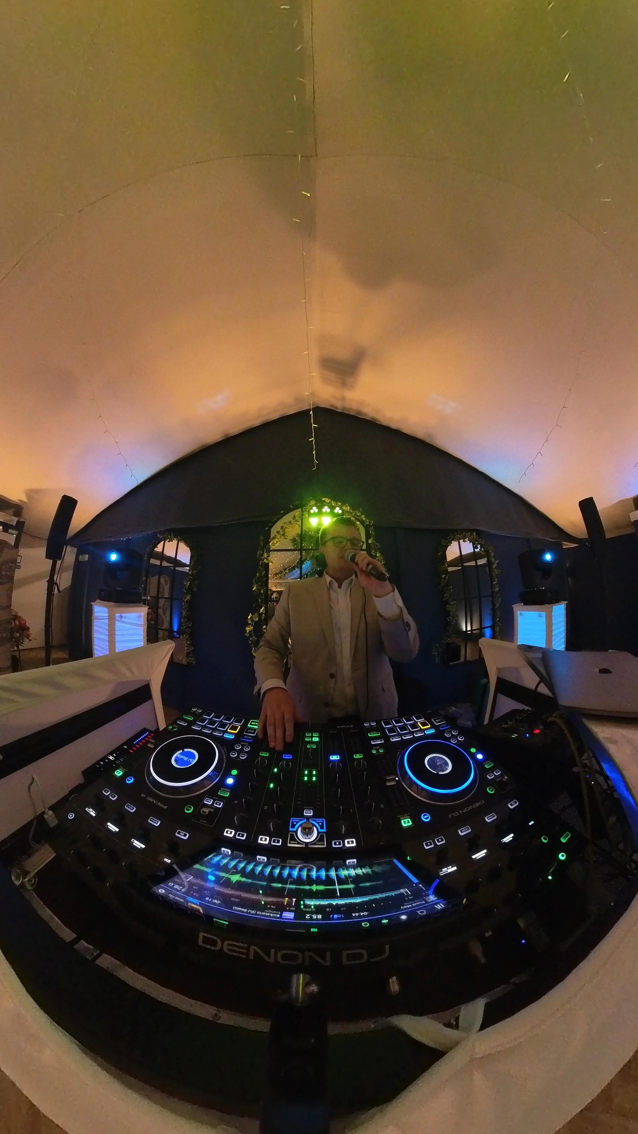 Harry from HM Sound & Events DJing inside a wedding marquee