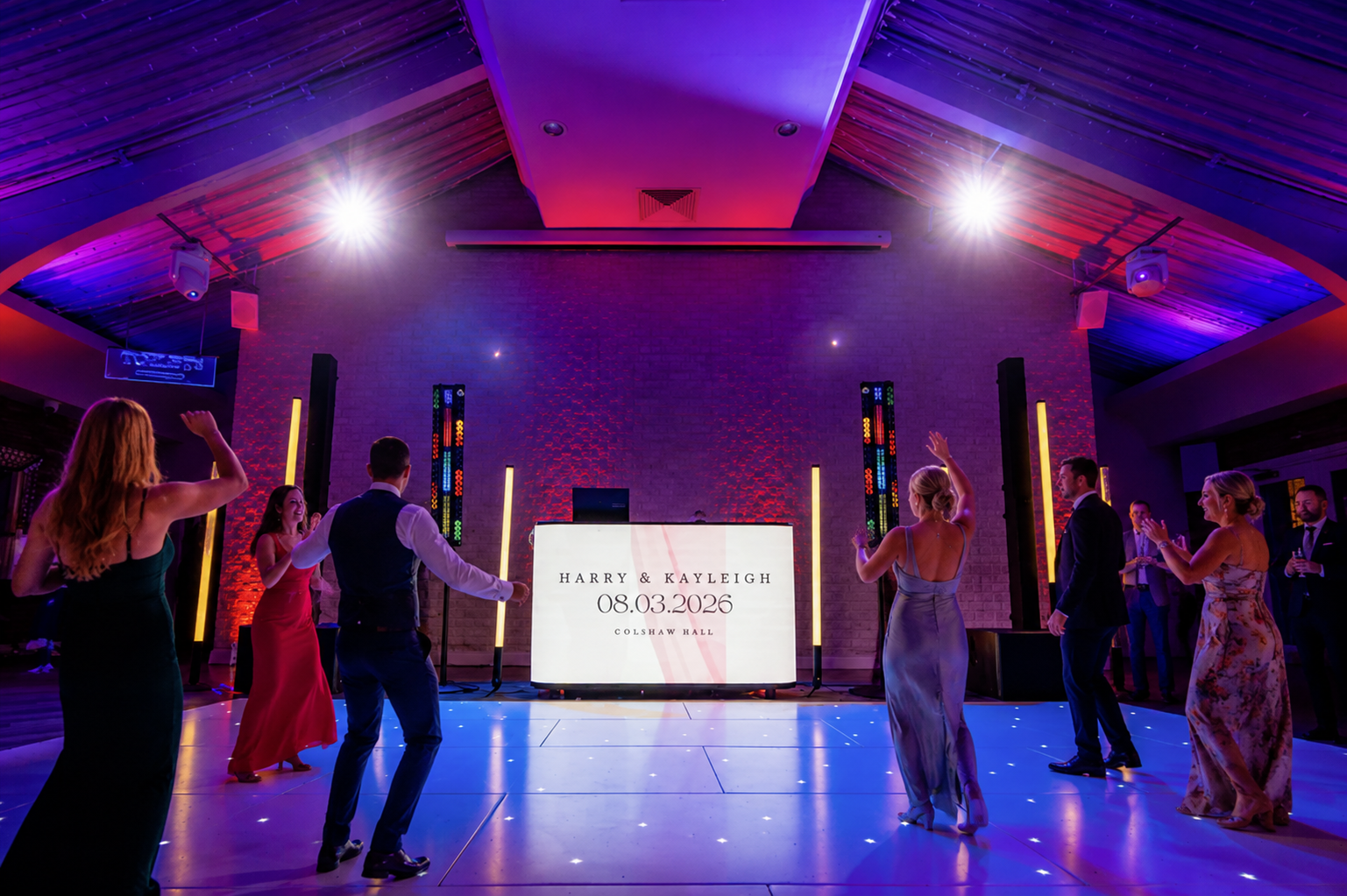 LED wedding DJ setup with lighting tubes and white dancefloor at Colshaw Hall