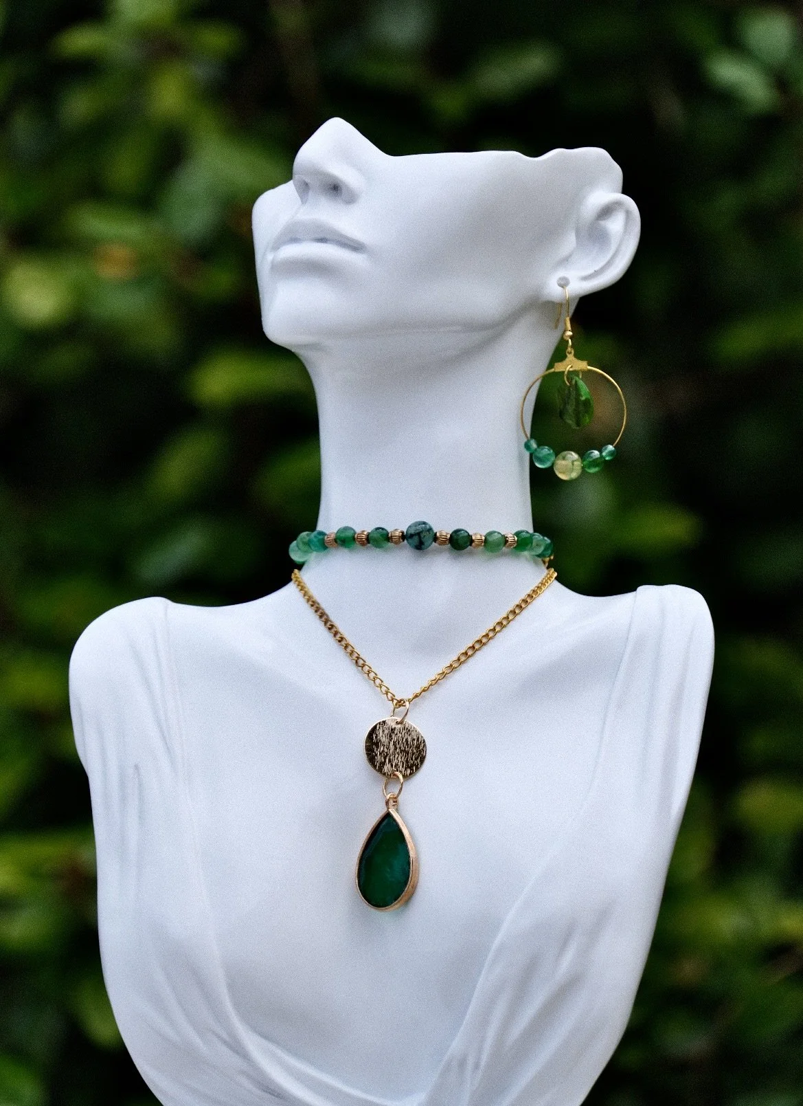 artisan layered emerald necklaces and earrings