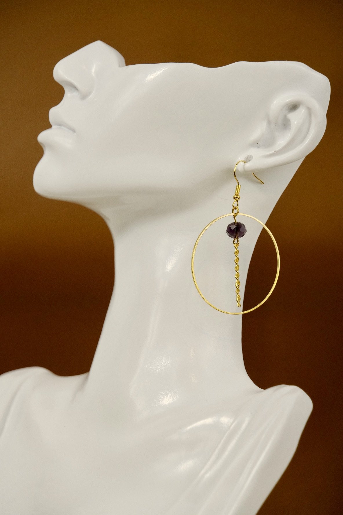 large view of the earrings worn