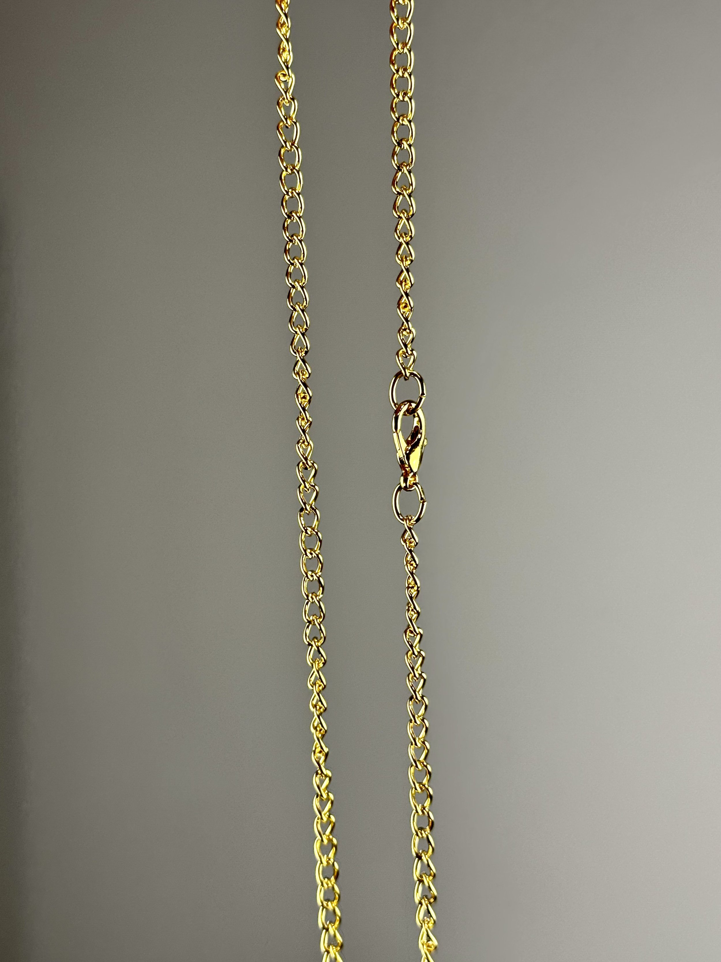 view of the chain of the orange glass pearl chocker