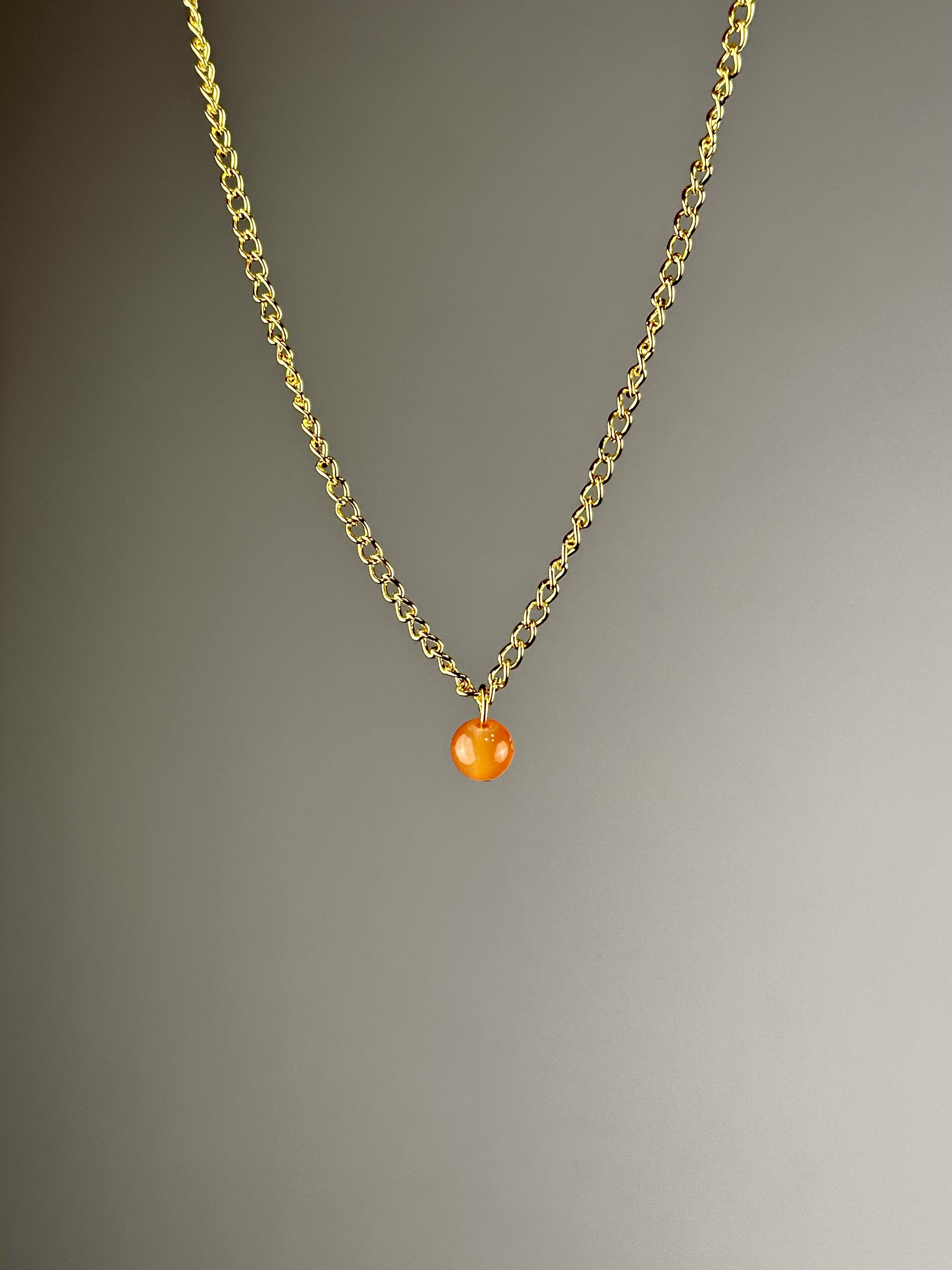 front view of the orange pearl choker