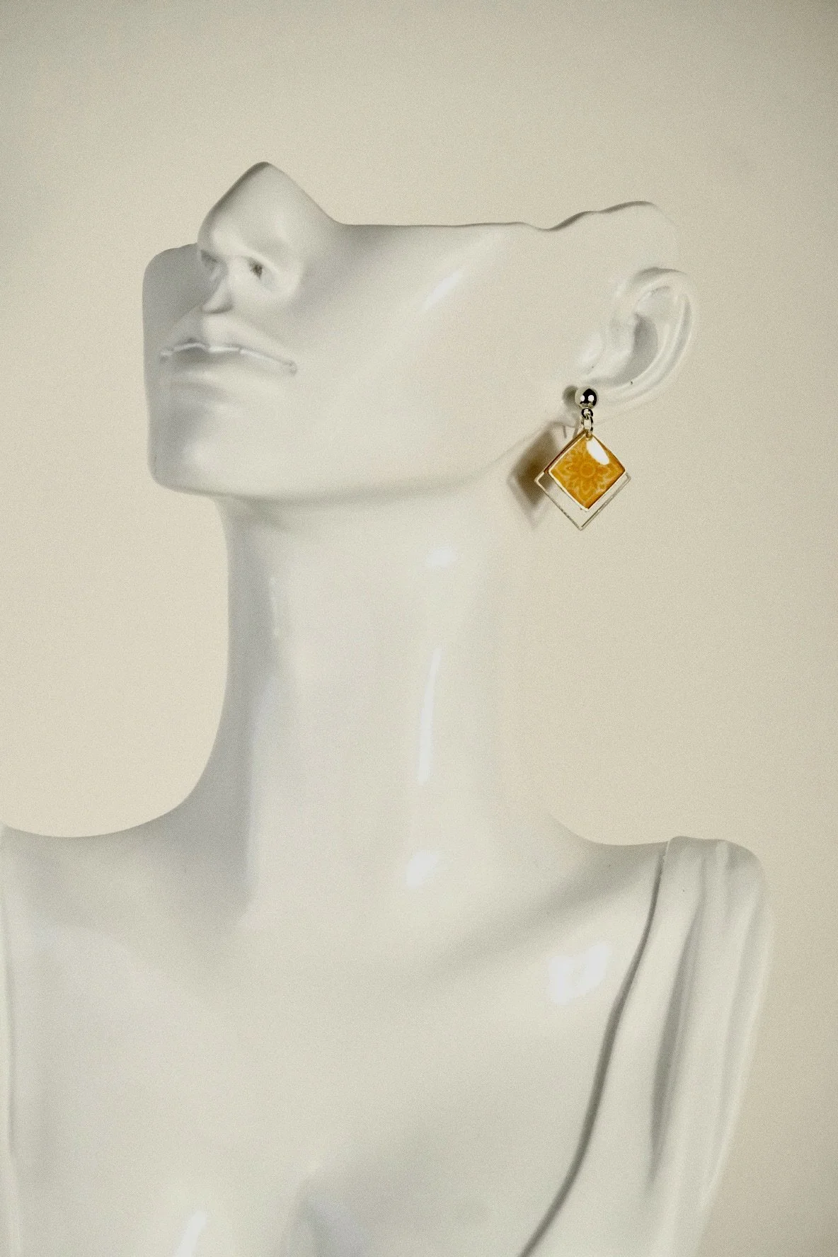 indigo roc floral orange resin earrings