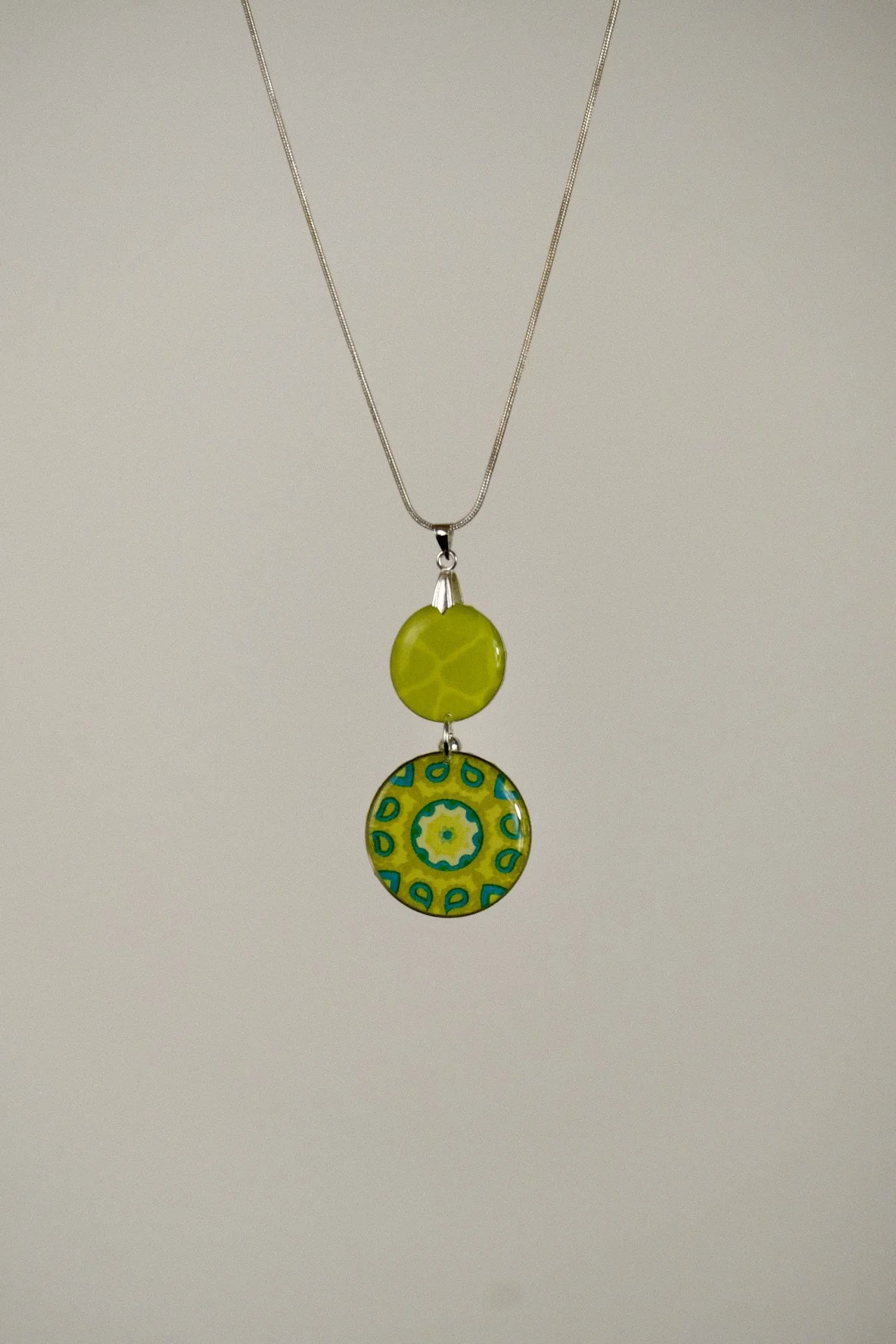 indigo roc mandala lime resin necklace