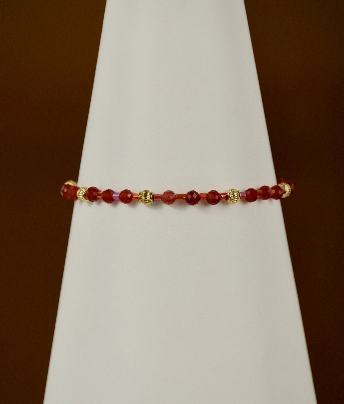 front view of open red berry bracelet