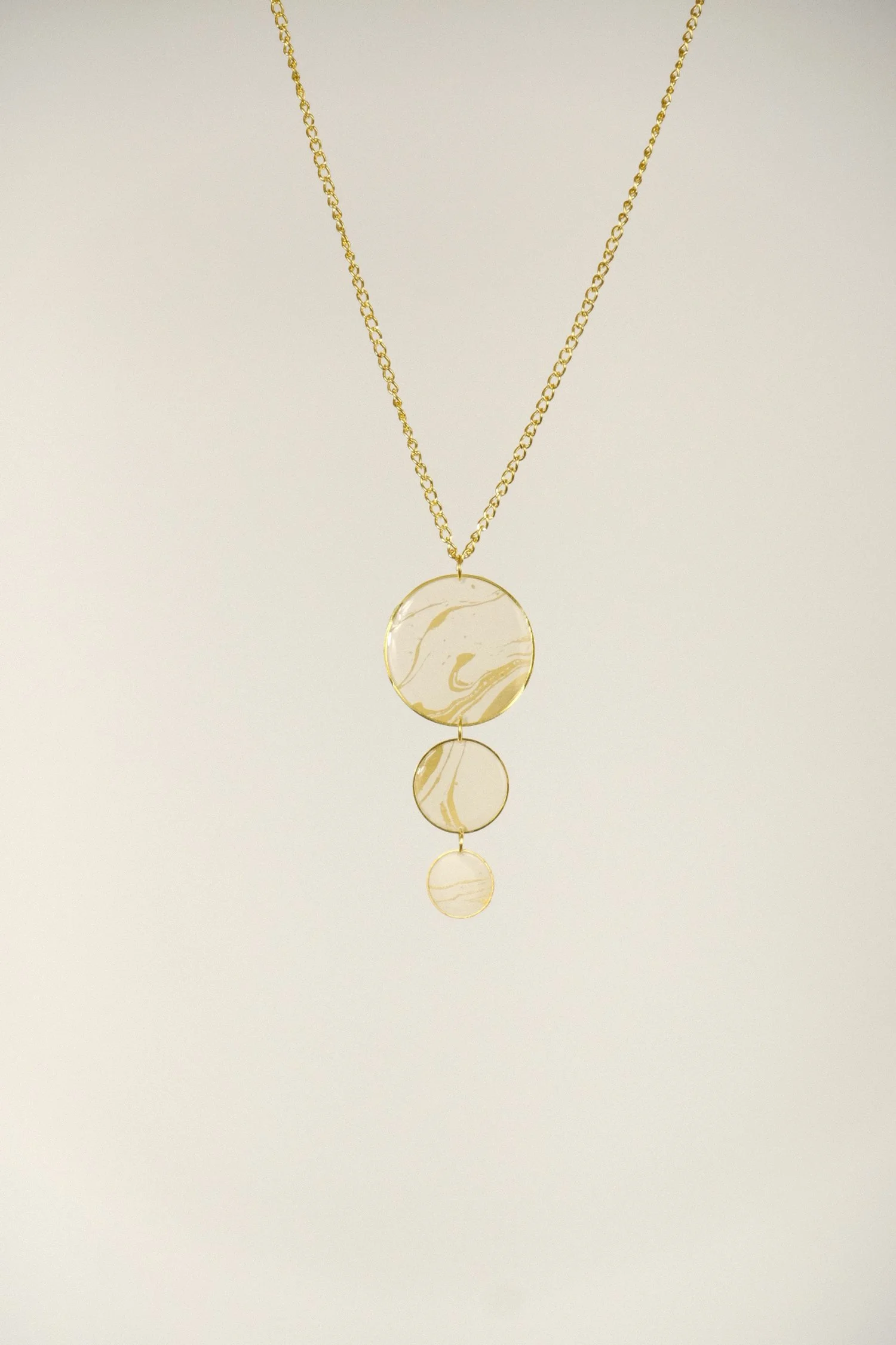 white and gold resin necklace