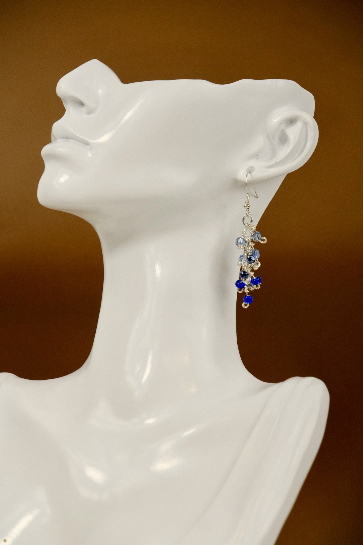 large view of the earrings worn