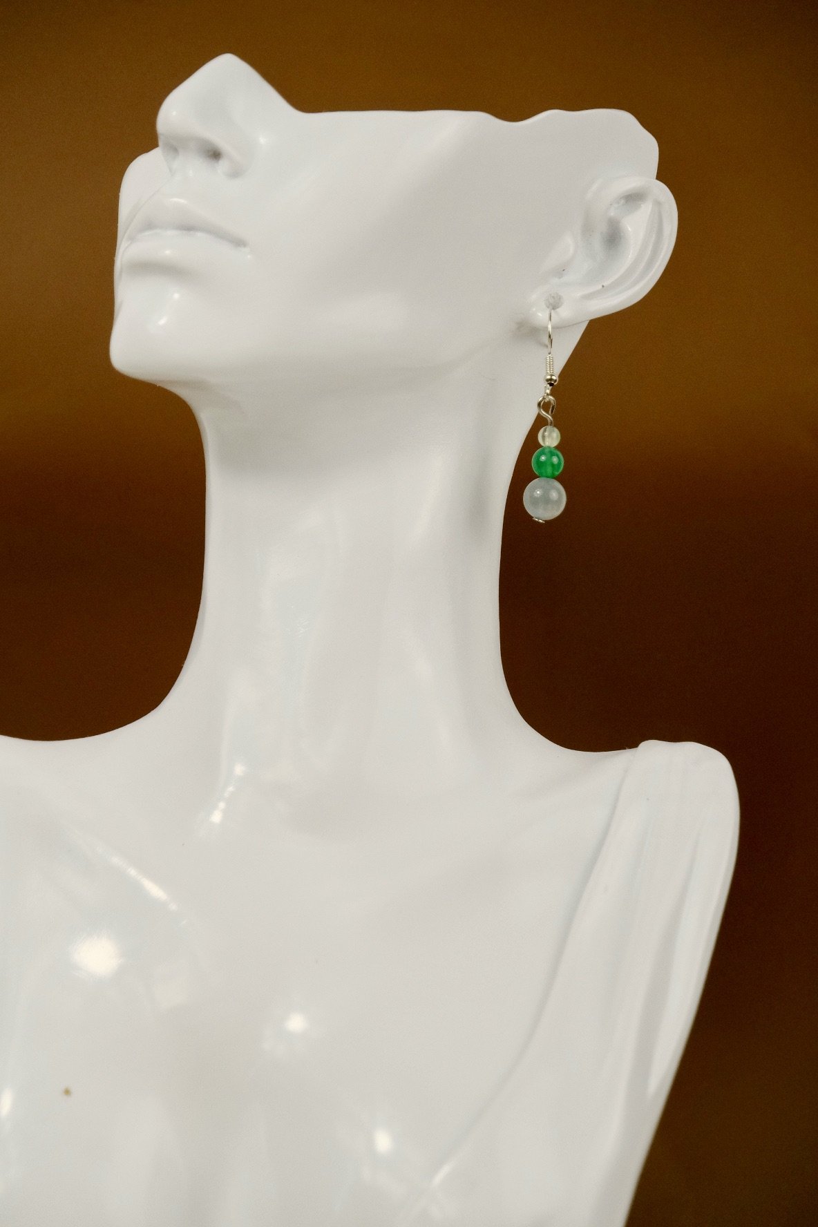 large view of the earrings worn