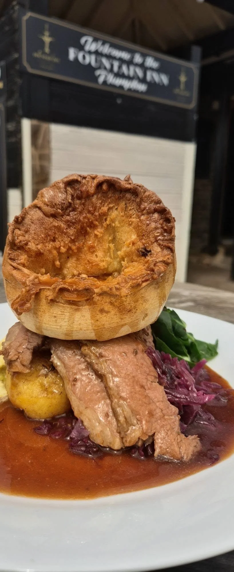 Sunday roast with a golden Yorkshire pudding, roast potatoes, vegetables and gravy at The Fountain Inn