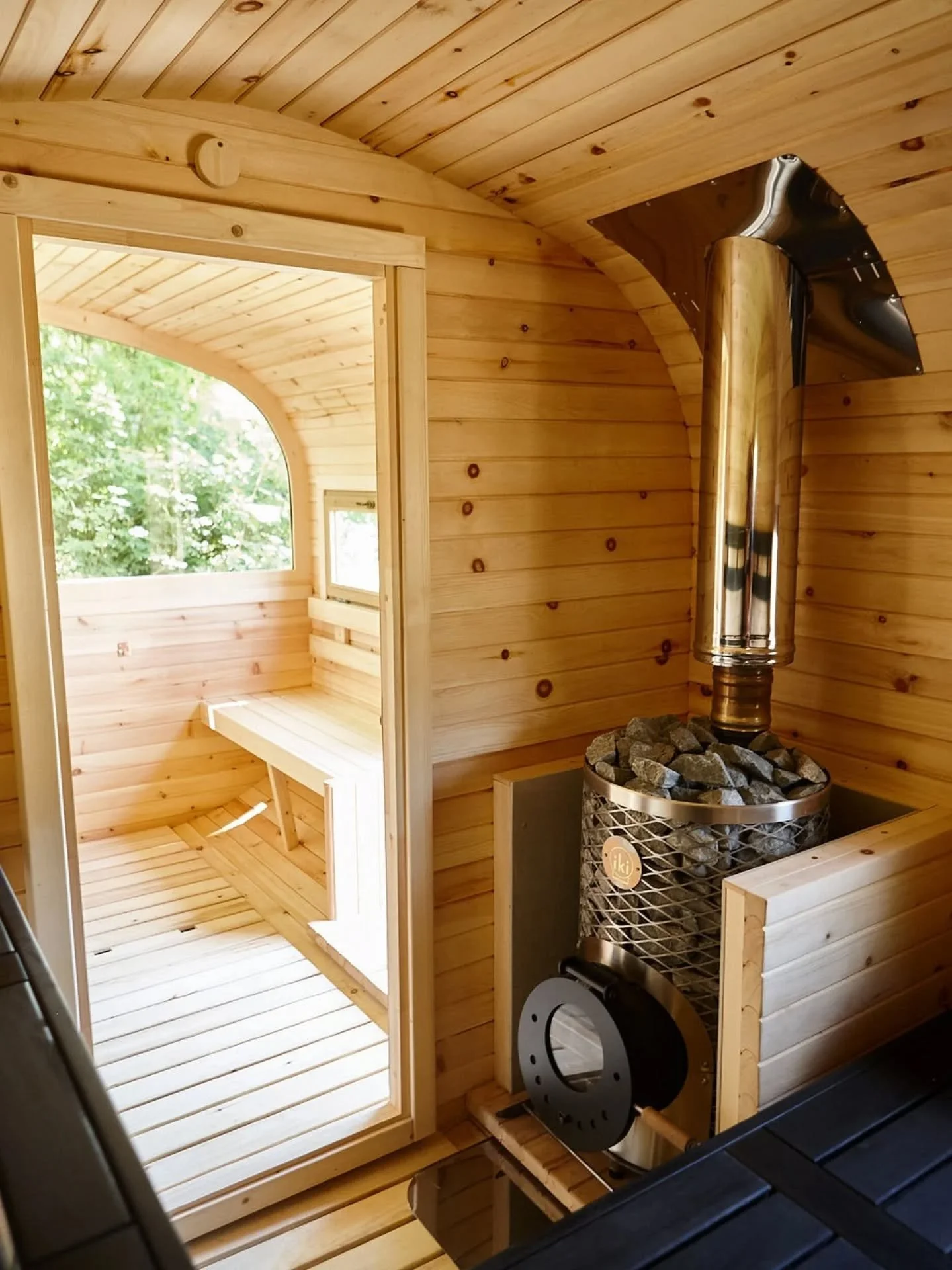 Our sauna was built to be dark and cosy on purpose. On a day like today &mdash; when it's a bit cooler, a bit greyer &mdash; it's actually the perfect place to be. 

You're still connected to nature and the elements, just feeling held by it rather th