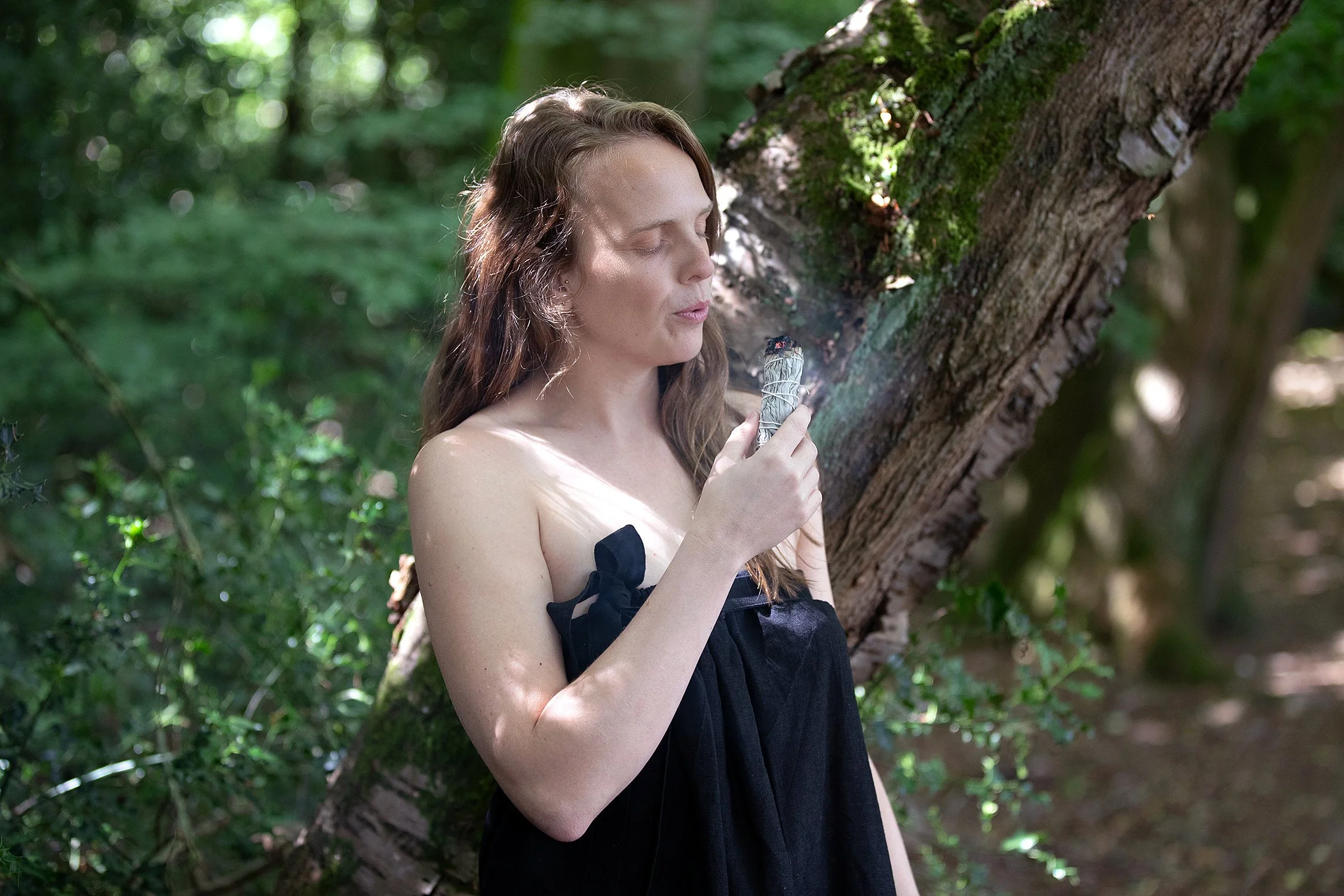 Sauna host with aromatherapy among the trees at Chiltern Sauna Circle