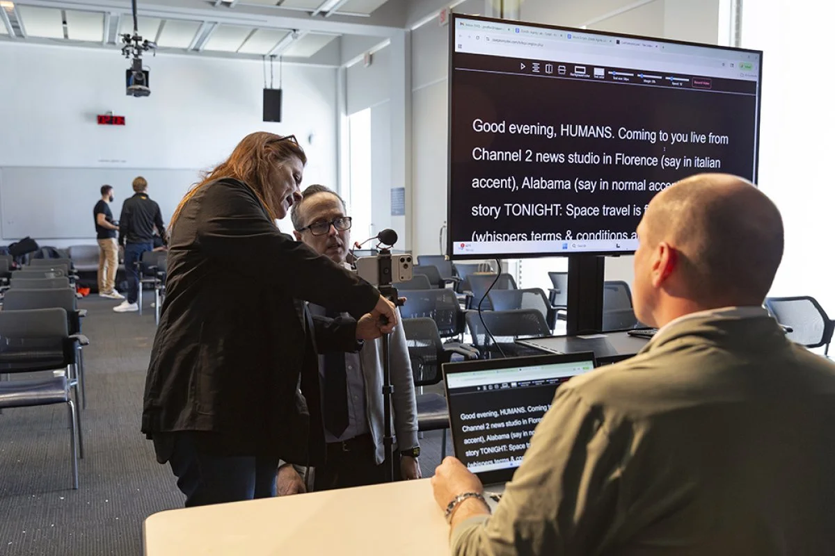 Professors prepare for a talk show with a Zenith participant. Source: ETC.