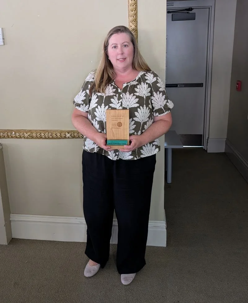 Photo of Robin A. Leaf, MEd with the Pitt Green Office Sustainable Oak Designation. Source: Pitt Department of Occupational Therapy.