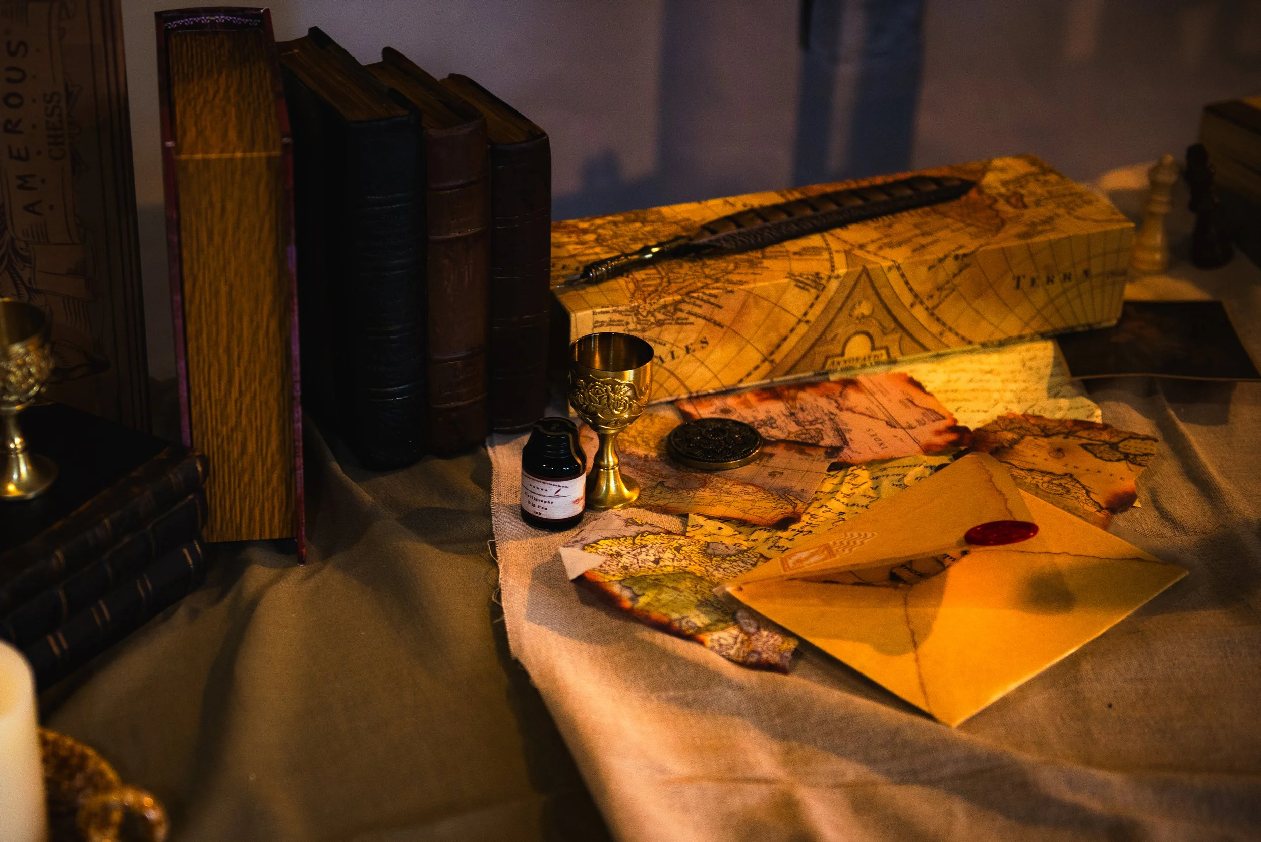 Photo shows the GhAIst experience, including the touchscreen journal, the decorated desk with props, and the three framed screens on the wall with memories from Priestley's life. Source: GhAIst Team.