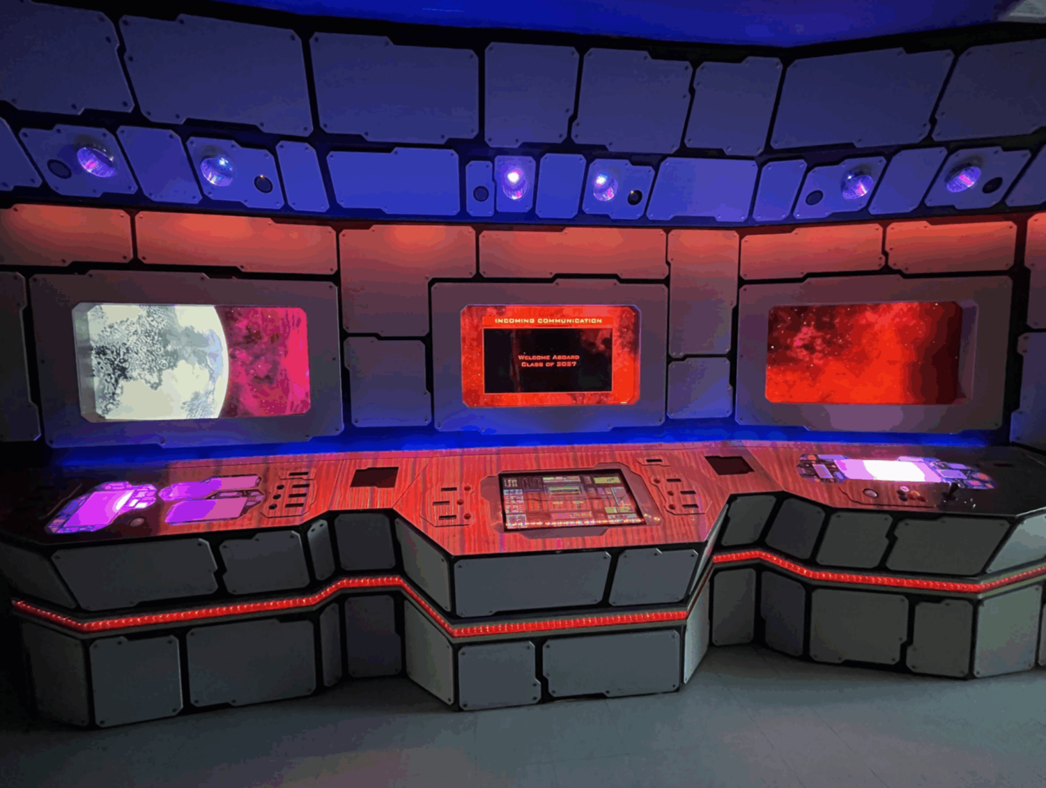 The Intergalactic Buttoneers, a team of Entertainment Technology Center (ETC) master's students, developed a series of location-based experience prototypes and modernized the iconic ETC Space Bridge in time for the 2025 ETC Fall Festival.