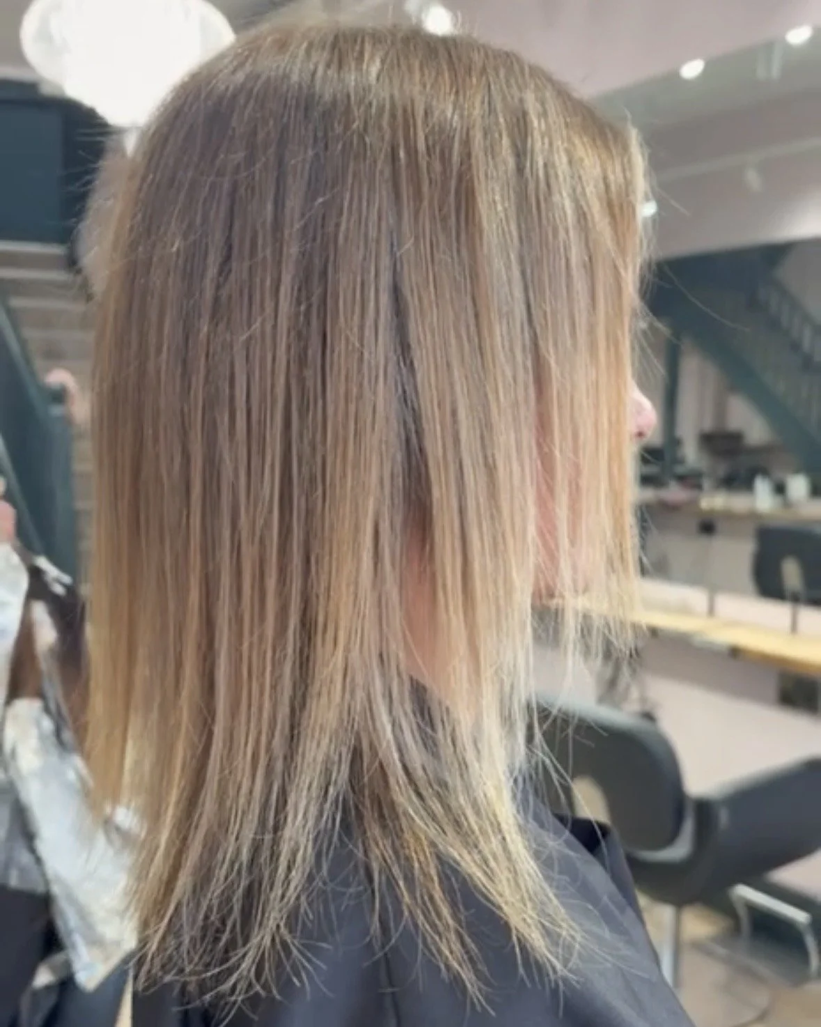 Natural hair prepared for a discreet volume and thickness upgrade using tape-in extensions at Nichares in Taunton.