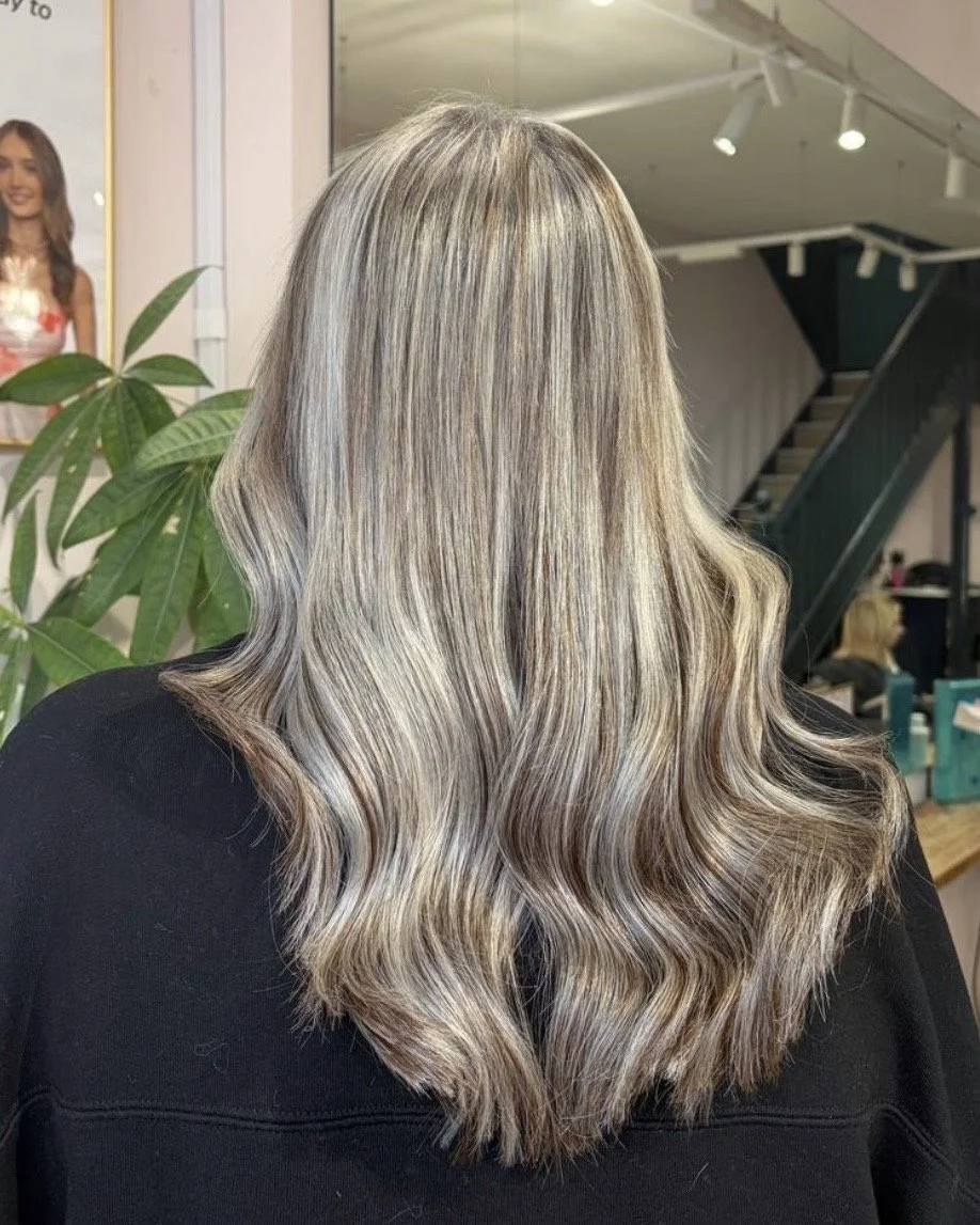 Lightweight tape-in hair extensions adding gorgeous thickness, volume, and bounce at Nichares Hairdressing in Taunton.