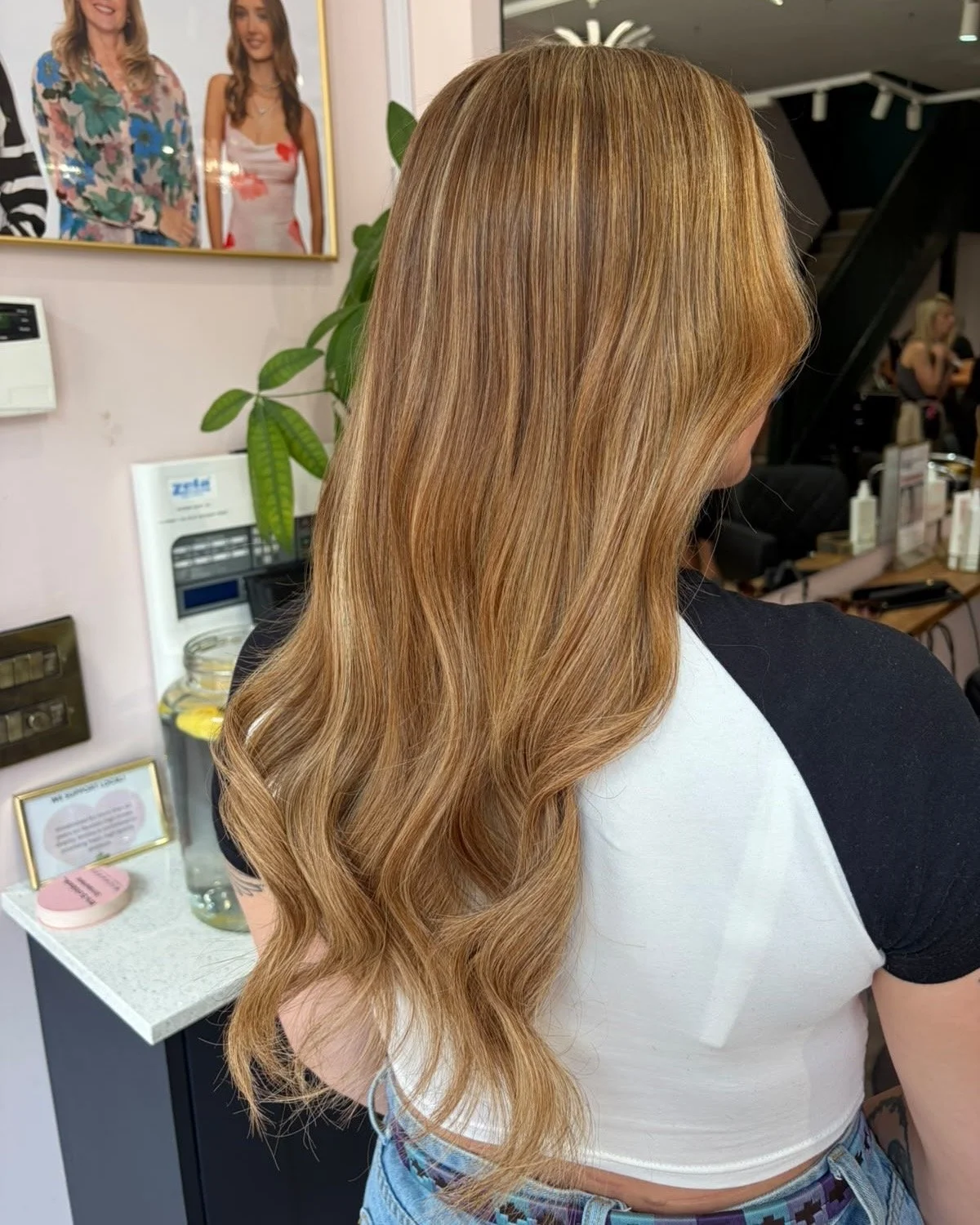Lightweight tape-in hair extensions adding gorgeous thickness, volume, and bounce at Nichares Hairdressing in Taunton.