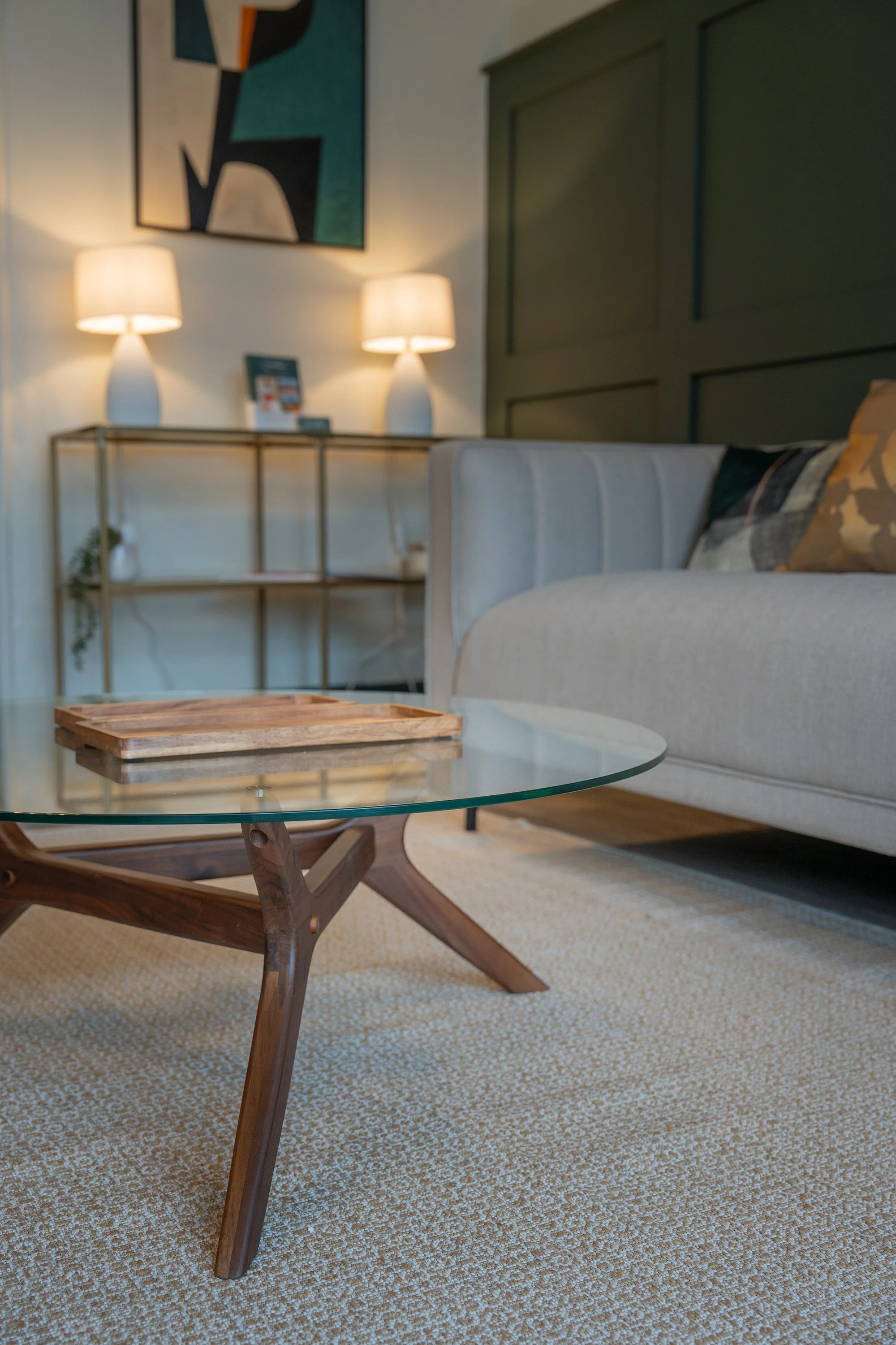 Modern glass coffee table and contemporary seating area in a thoughtfully designed Grantham's Estates estate agency office interior.