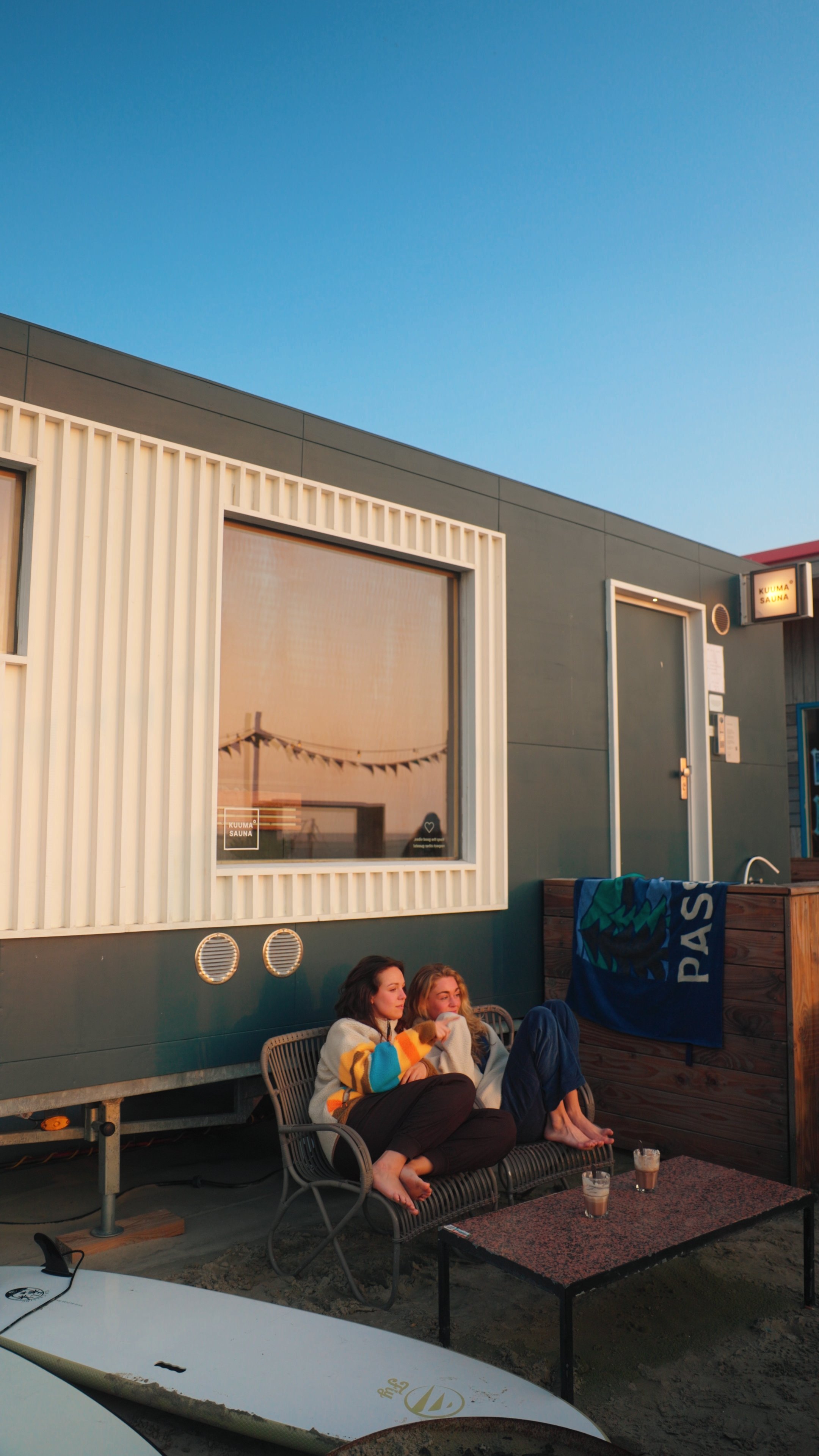 Post surf chilling after sauna session, surf lifestyle and clothing photography
