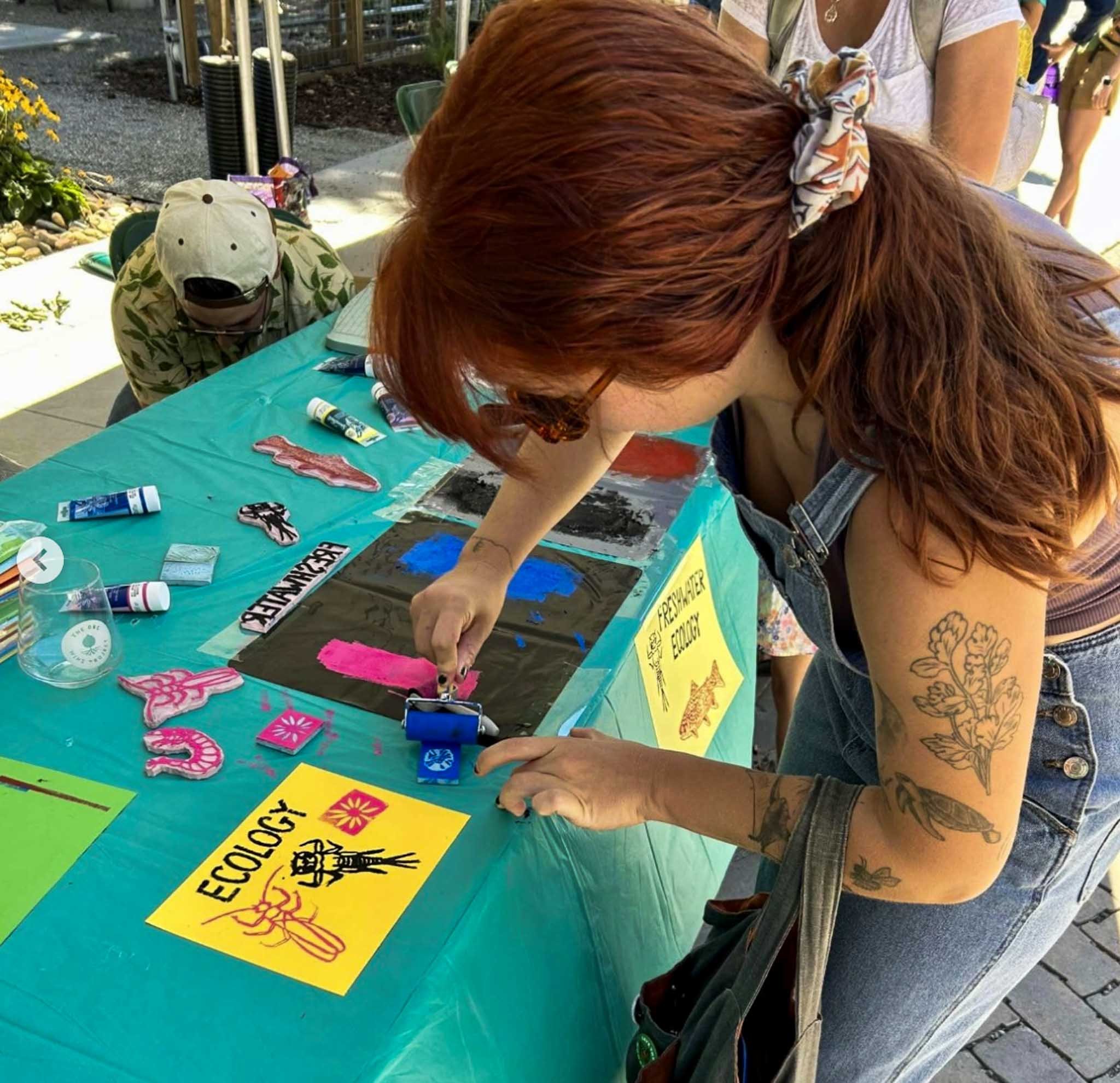 person making a trout and macroinvertebrate block print