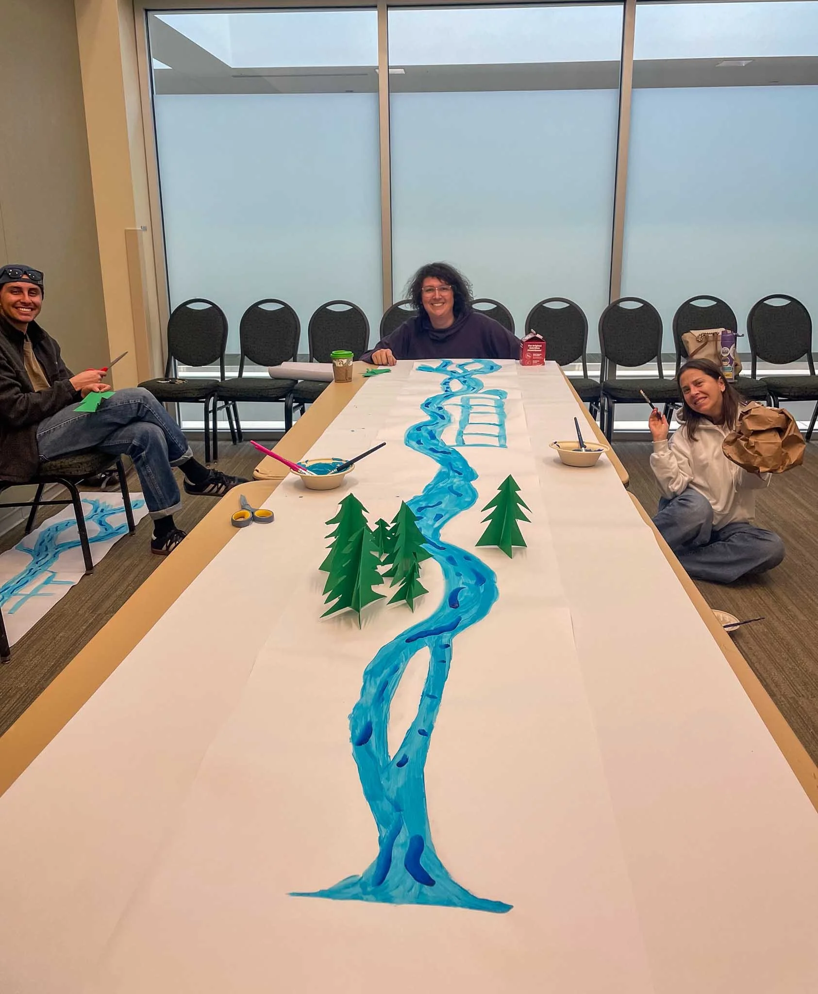 people building a diy watershed from paper