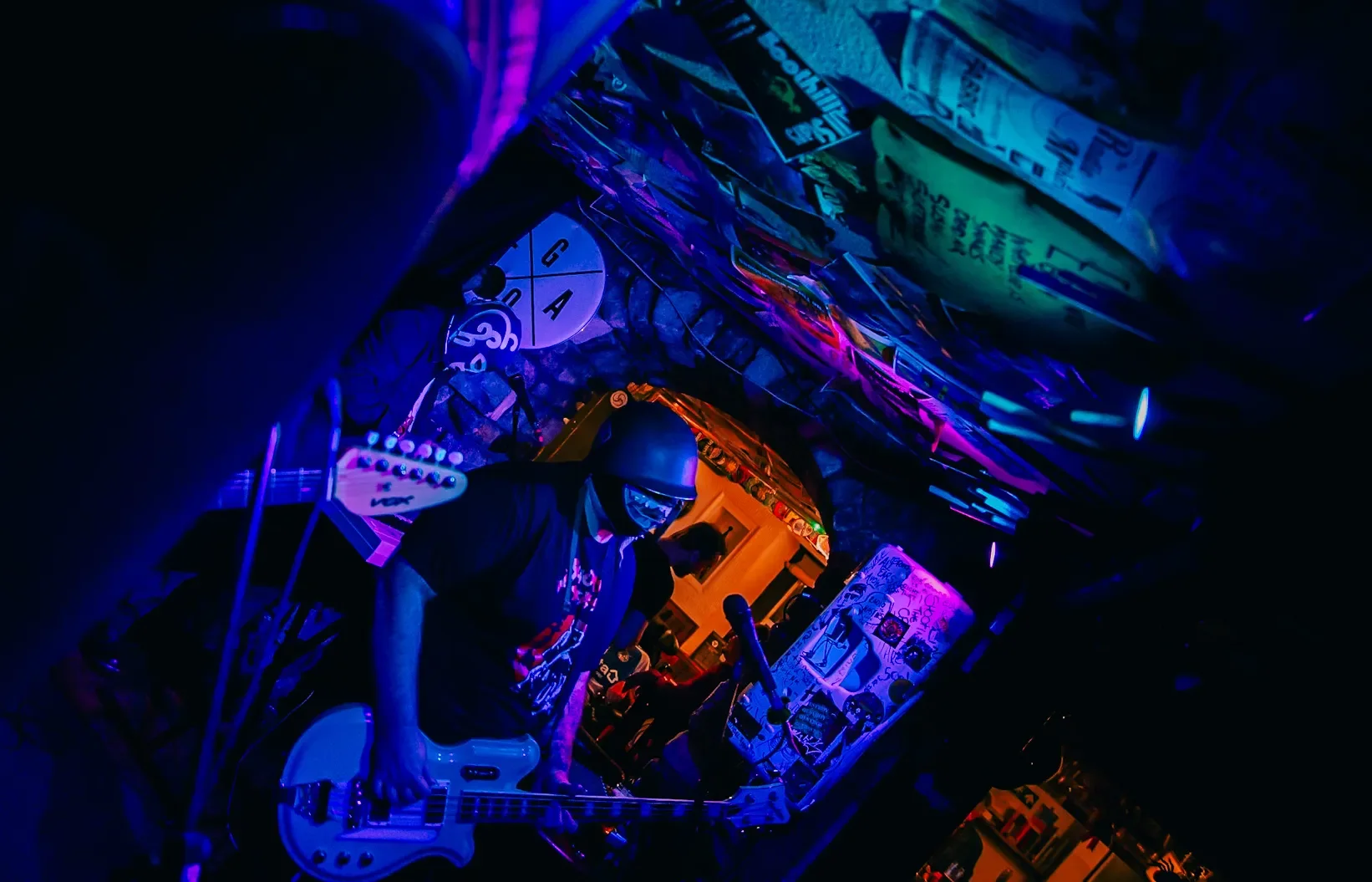 The Bucky Rage, a band wearing wrestling masks playing a set at the Three Horseshoes in Bradford on Avon