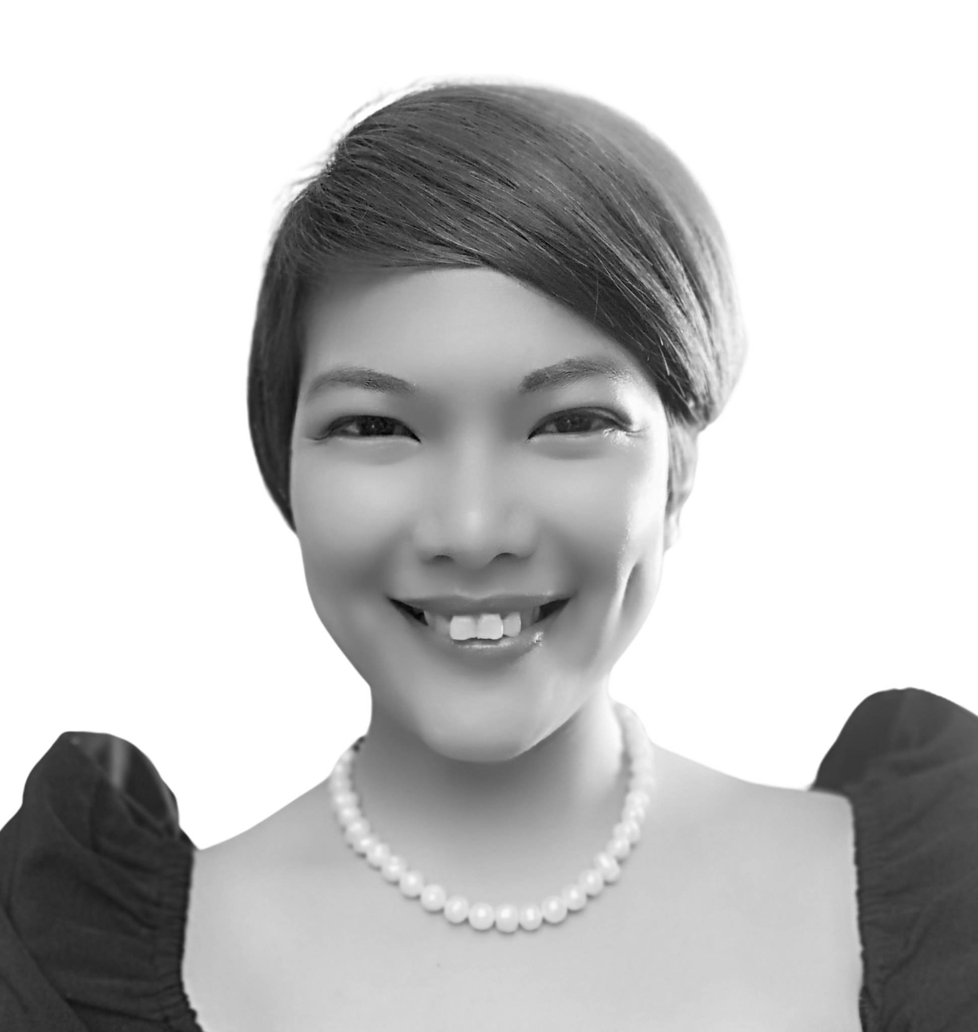 Close-up of a woman's face smiling, wearing a pearl necklace, with short, dark hair. She is dressed in a formal outfit with a dark top and pearl earrings.