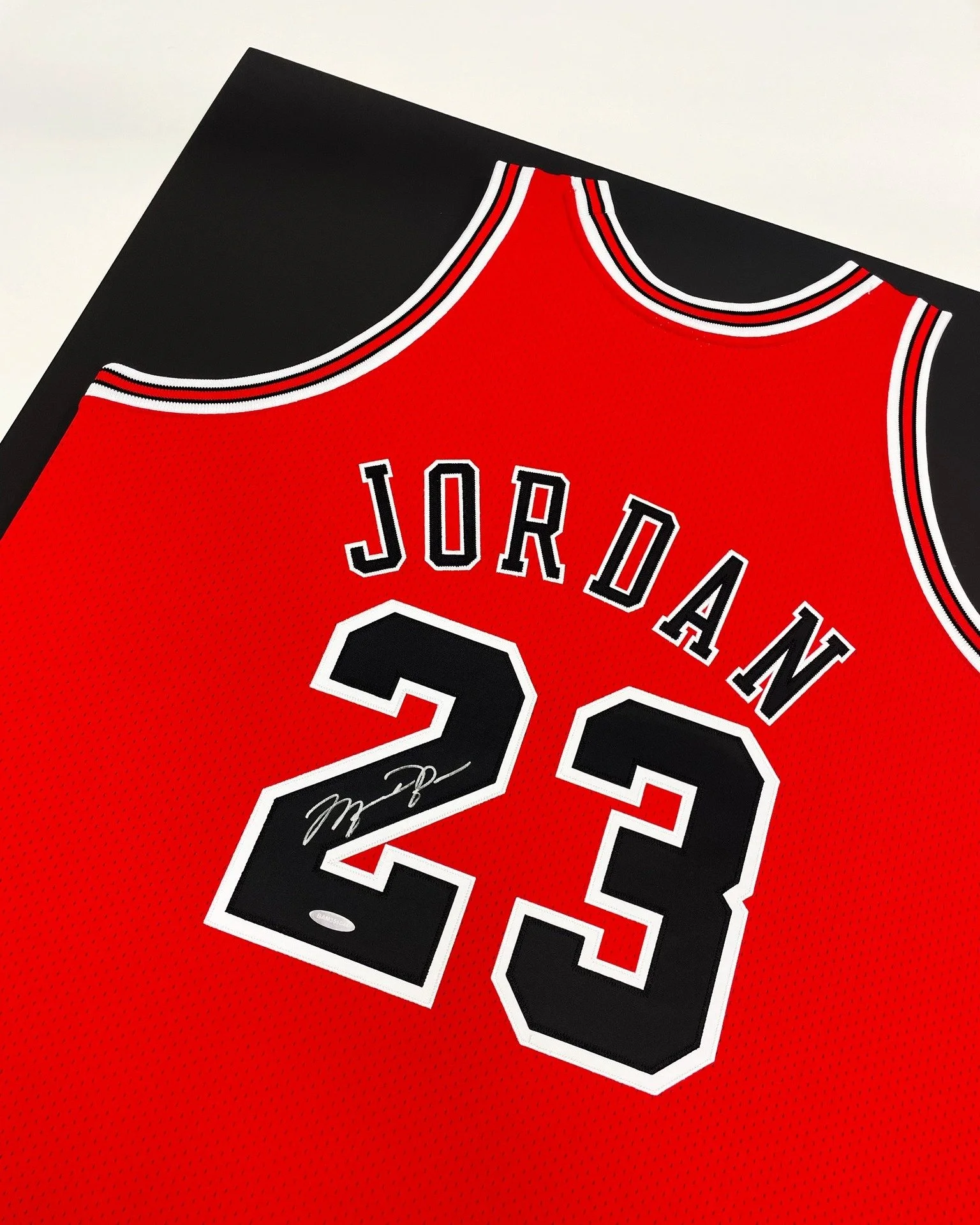 You see a red jersey with a #23 and you're immediately taken back to a much simpler time. Jordan on the court, flying towards the hoop, 6 national championships won. Boy were those good times. 

We love framing these jerseys and what they represent. 