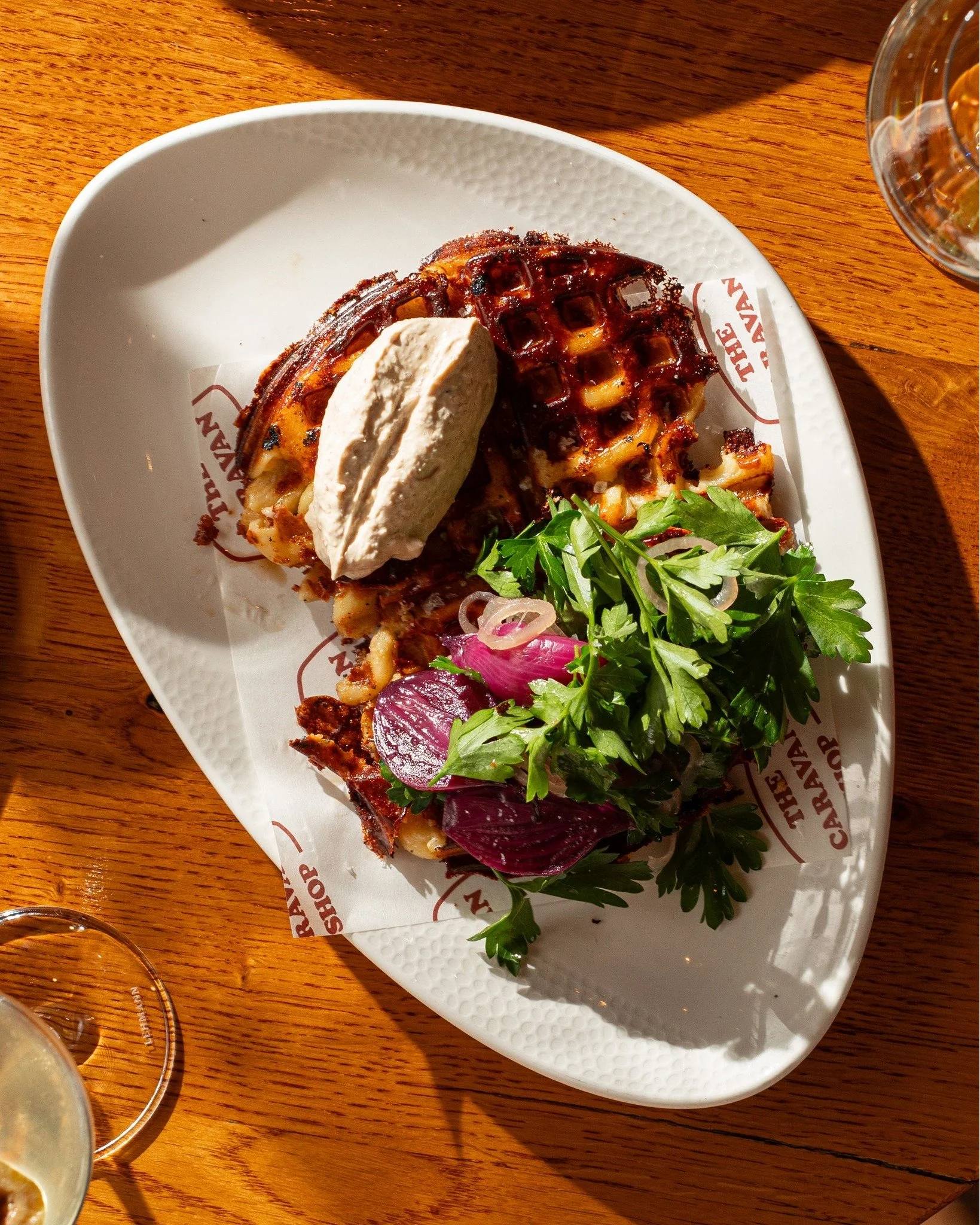 Our mac &amp; cheese waffle, oysters, beef tartare, gildas &amp; charcuterie. All the best plates at The Caravan Shop.