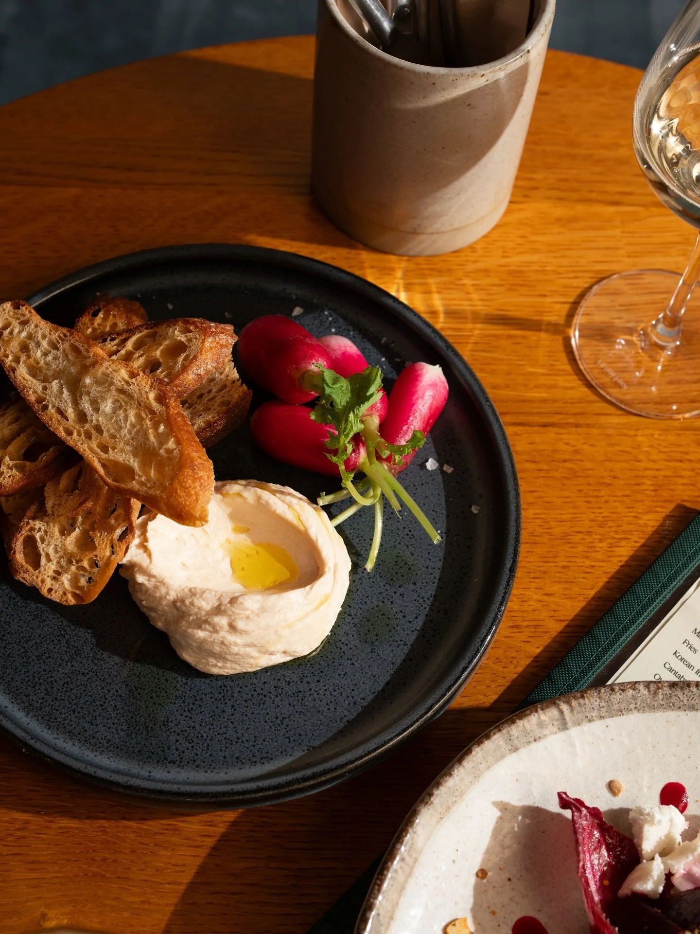 Warning: this whipped cod roe has been known to cause arguments over who gets the last scoop.
Crispy sourdough, fresh radish, too much olive oil (in a good way).
Pair it with a glass of white and call it a day. 💅