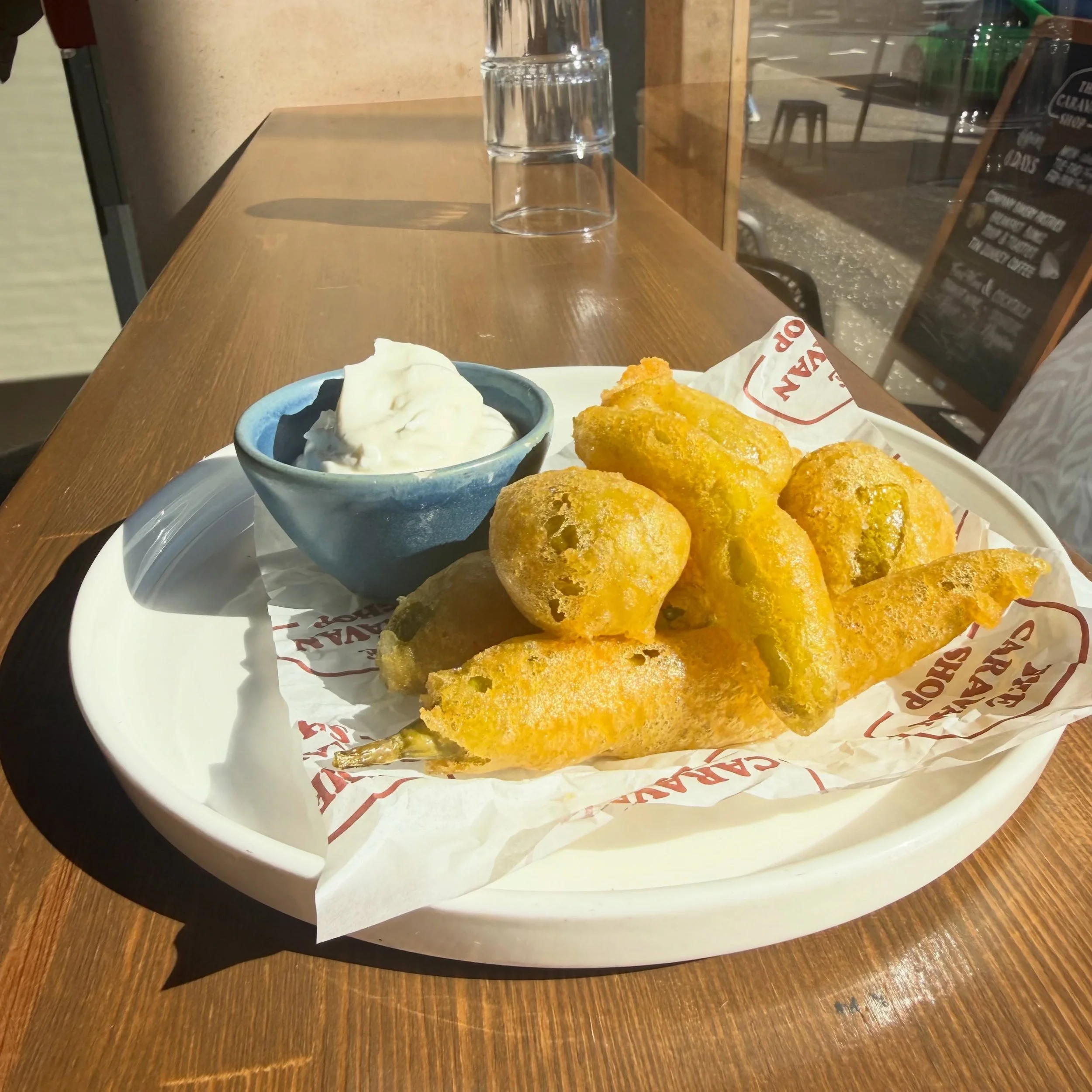 Crispy fried gordal olives and guindilla chillies with lemon &amp; garlic yogurt.

Awesome in the sun ☀️ or rain ☔️ depending on what moment of today it is! 

We are open! Come say hi! 🫶