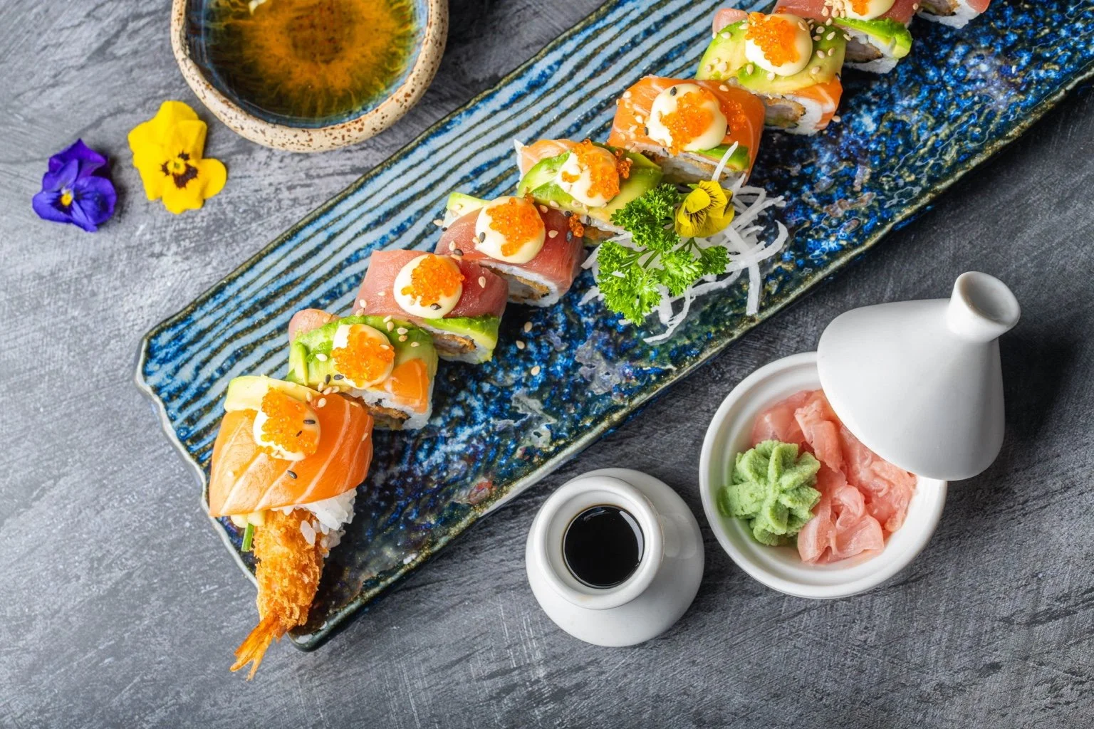 Colourful salmon, tuna and avocado sushi selection at Sushi & Salad.