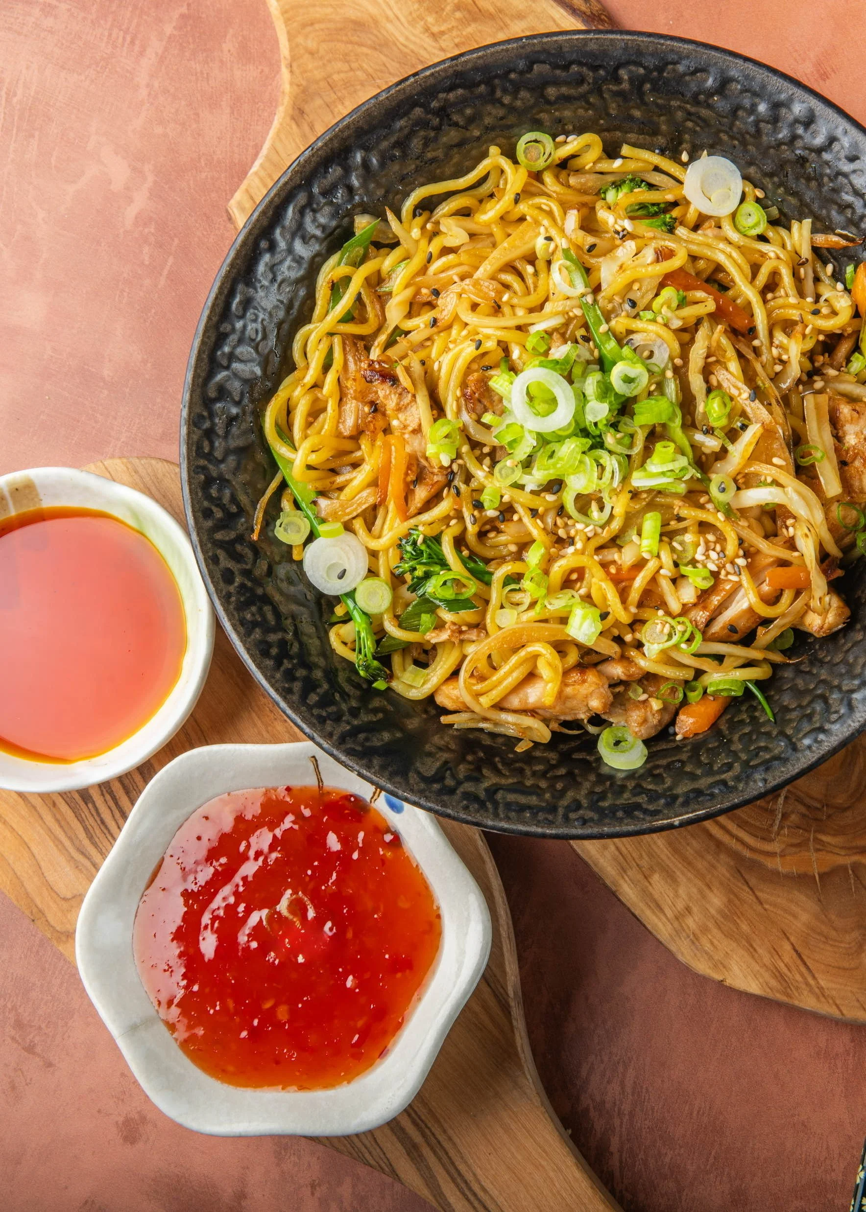 Japanese noodles with vegetables, spring onions and dipping sauces at Sushi & Salad.