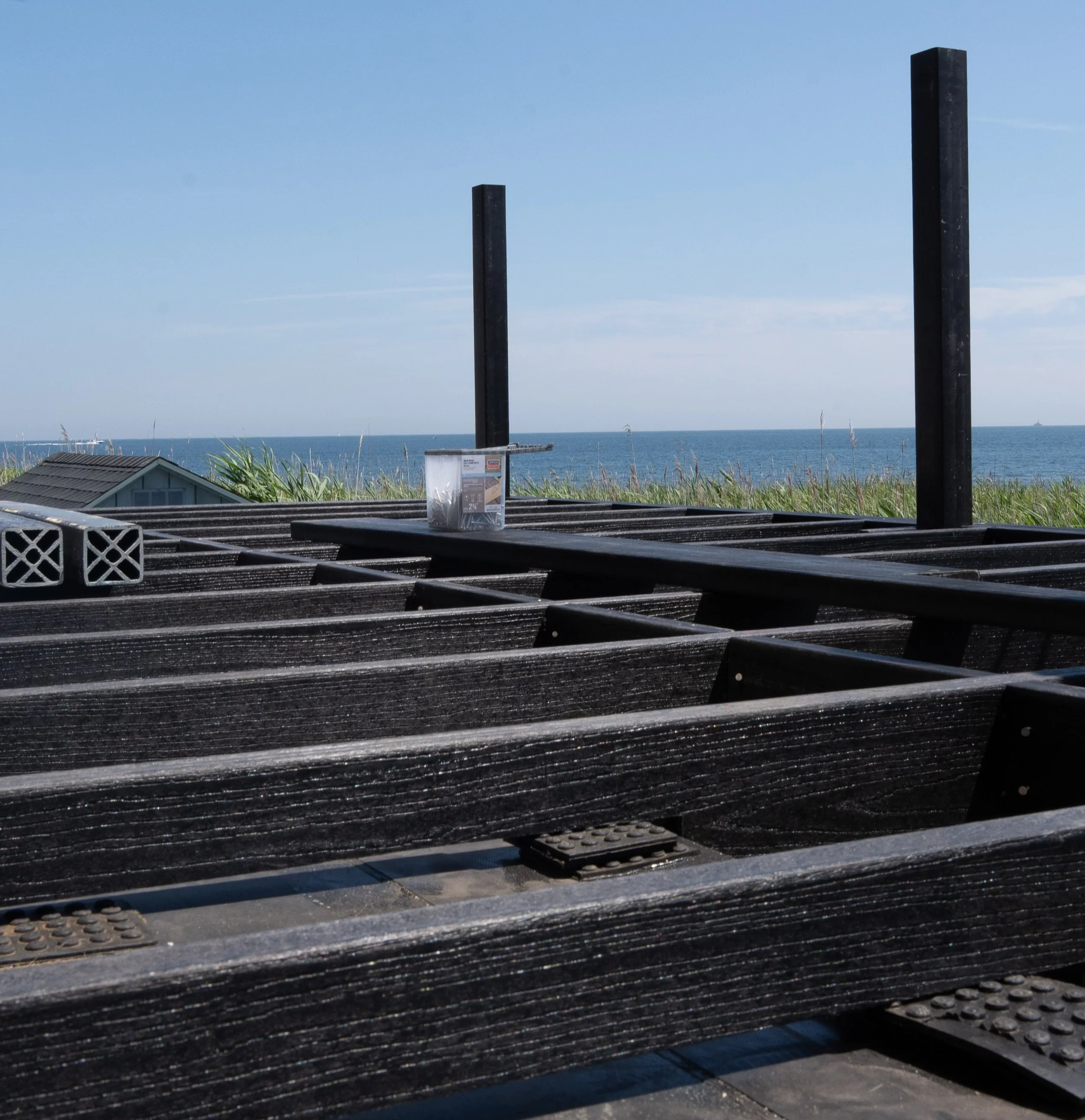 Progress update! Framing this deck out with Owens Corning composite framing lumber &mdash; solid foundation, built to last, especially at this oceanfront location. The real challenge? Getting the EPDM flat roof section dialed in just right. A few cur