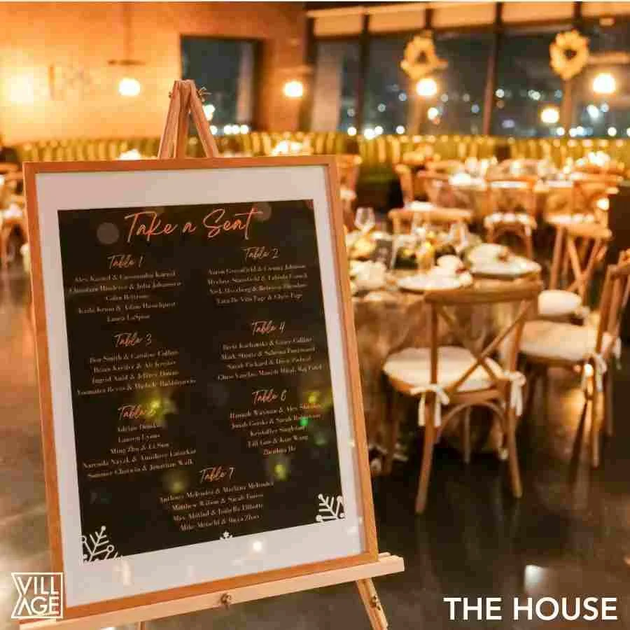 Restaurant with decorated tables and a holiday-themed menu board on display.