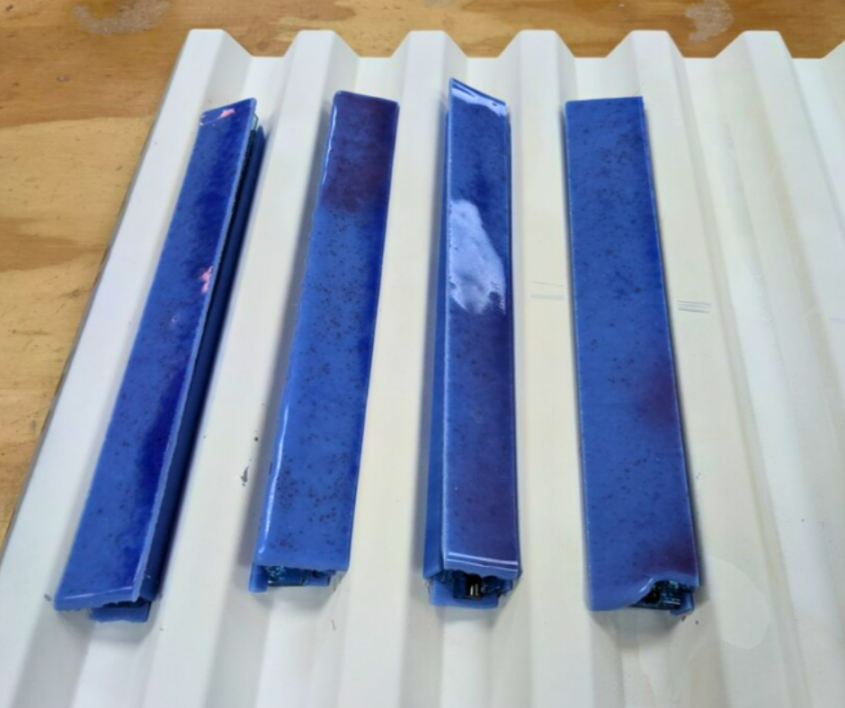 These were fired to a full fuse, then cut at oblique angles to reveal the murrine pattern in relief.