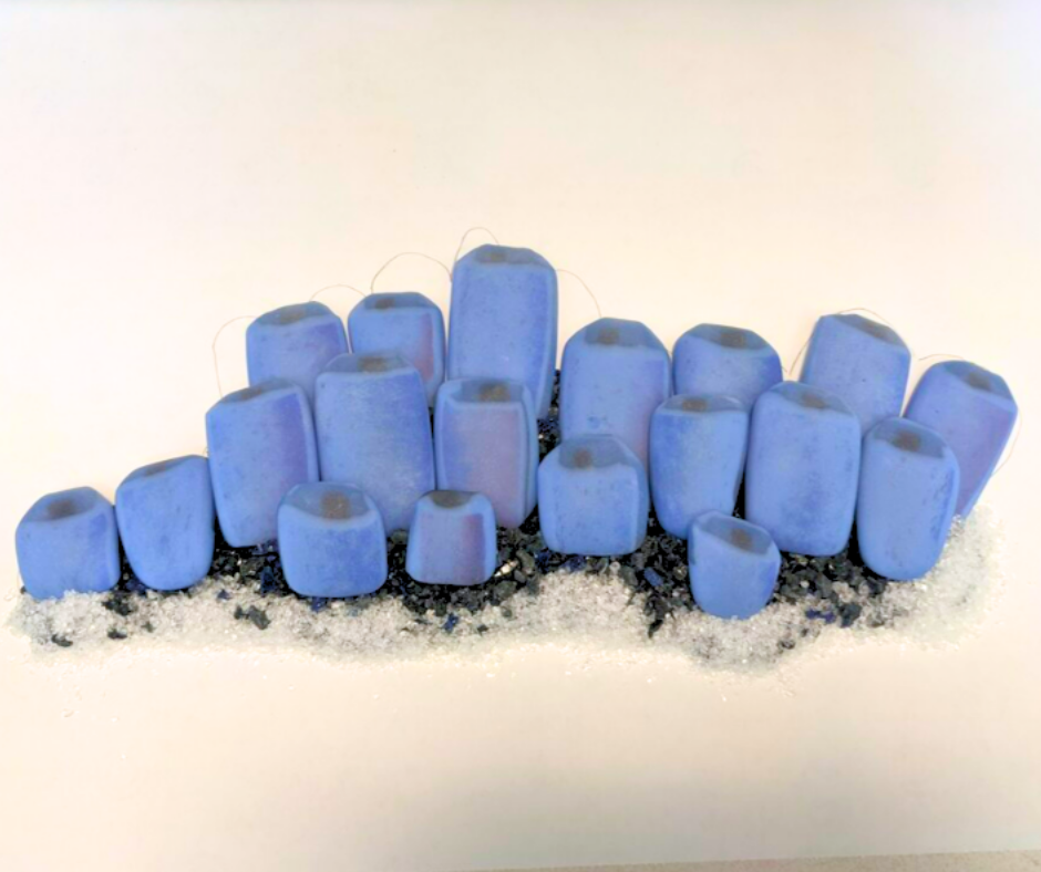 These tubeworms were sandblasted, laid on a bed of frit, then tack fused to create a single glossy piece.